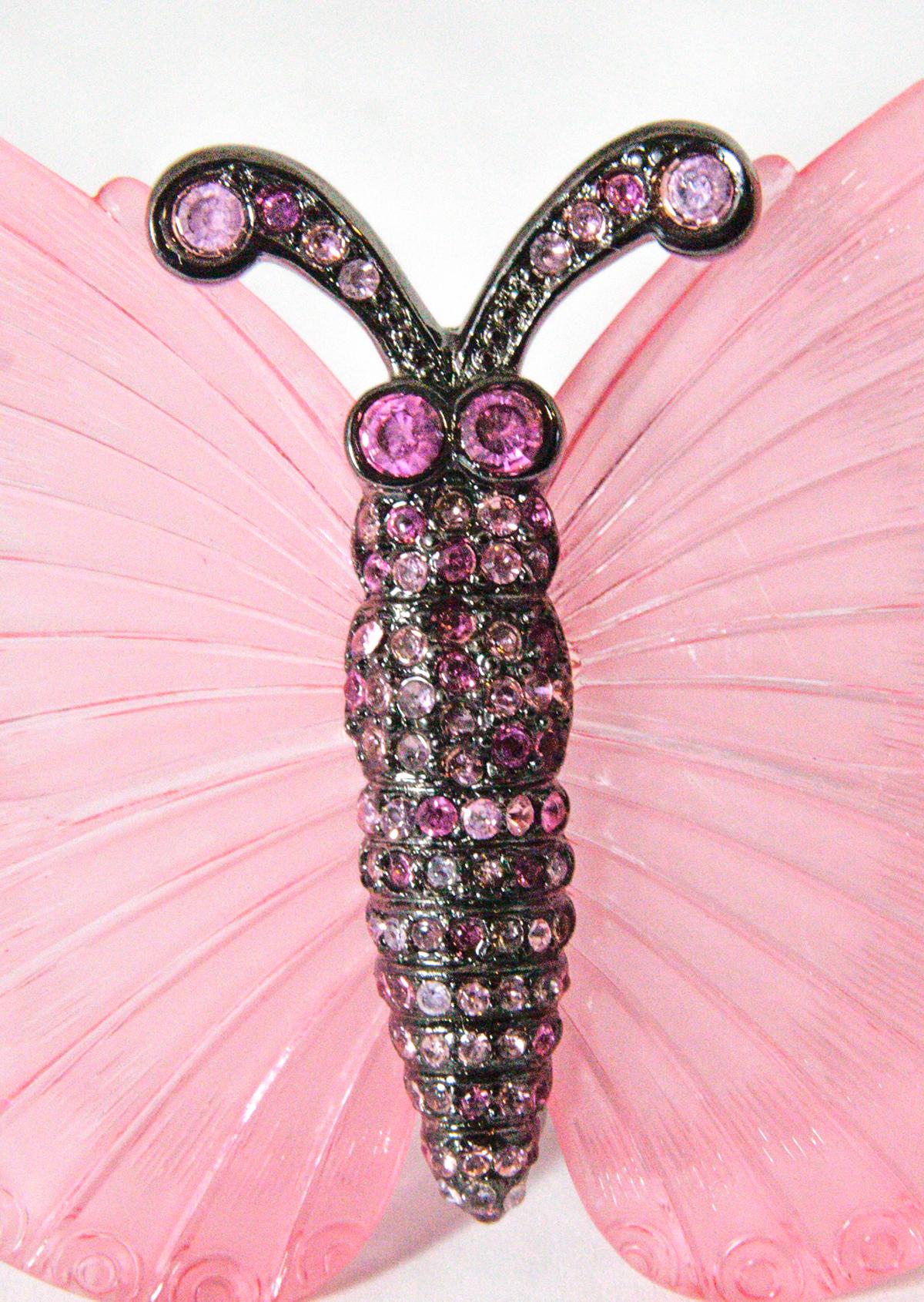 This signed Kenneth J. Lane brooch has a highly etched pink resin butterfly design with pink rhinestones in a Japanned setting. This piece has come back to the line after its successful debut in the late “60’s measures 3-1/4” x 2-1/2” and is signed