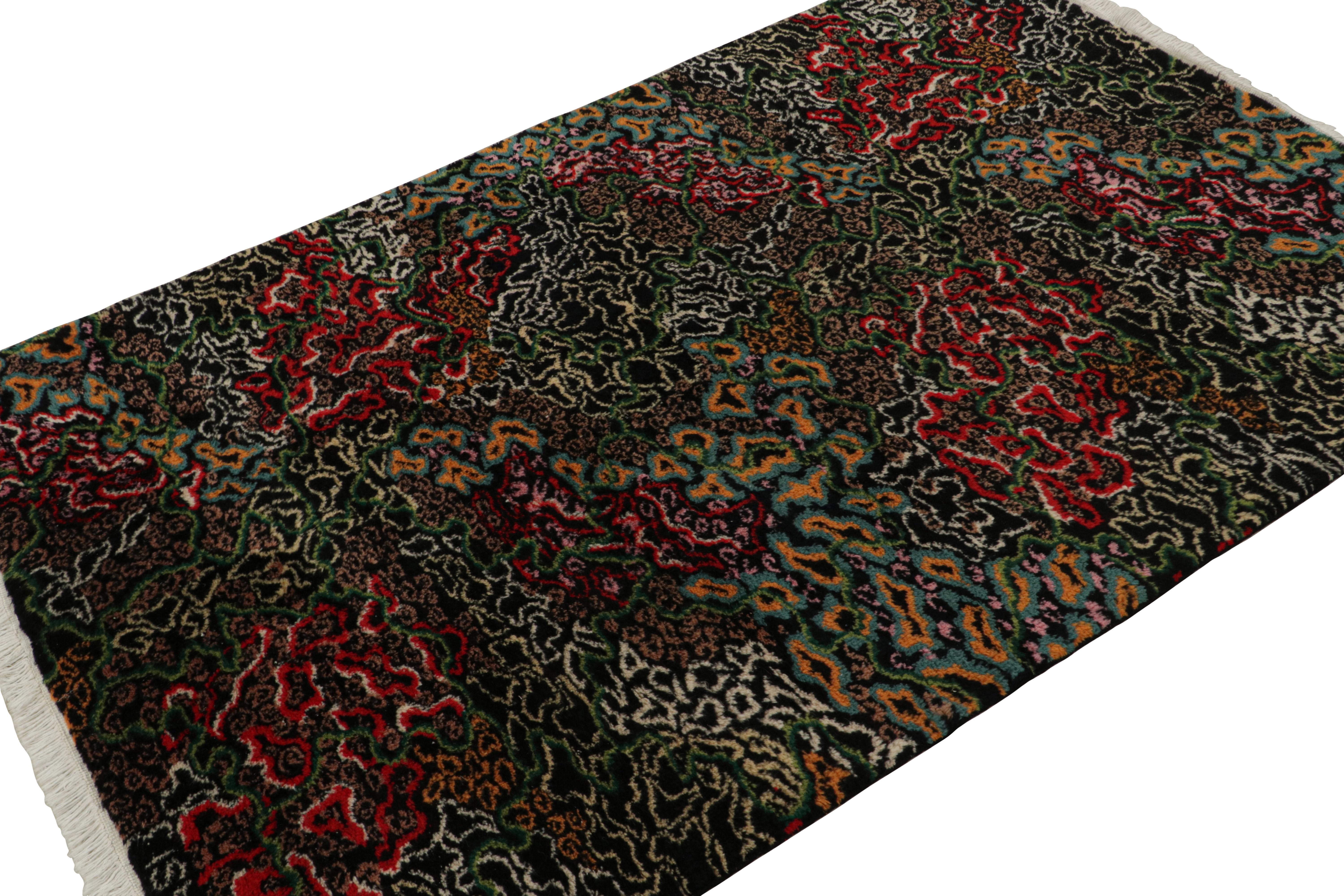 Hand-knotted in wool circa 1960-1970, this 4x6 vintage Zeki Müren Art Deco rug is a rare signed piece among the mid-century works of this Turkish artist. The lower-right corner hosts Müren’s own signature, while the upper-left corner reads “Sabir