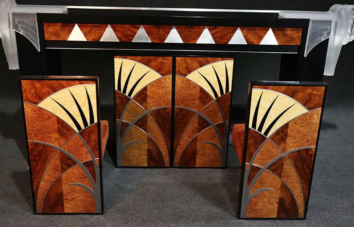 This is a true masterpiece and was commissioned by the owner at a cost in 2006 of over 100000.00 dollars and inspired by the Chrysler Building in New York City as the owner ran a bank in the Chrysler Building. The bar features a solid slab of black