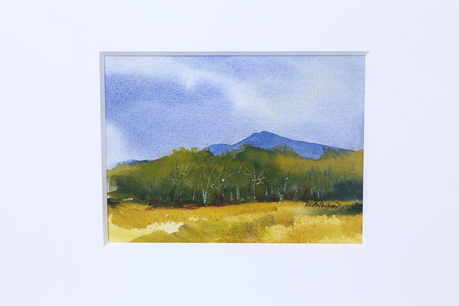 This is a signed watercolor landscape in a custom oversize frame with a white matt. Using a large frame and matt for smaller paintings gives the piece a stronger presence and automatically draws your eye to it. Great conversation piece for your