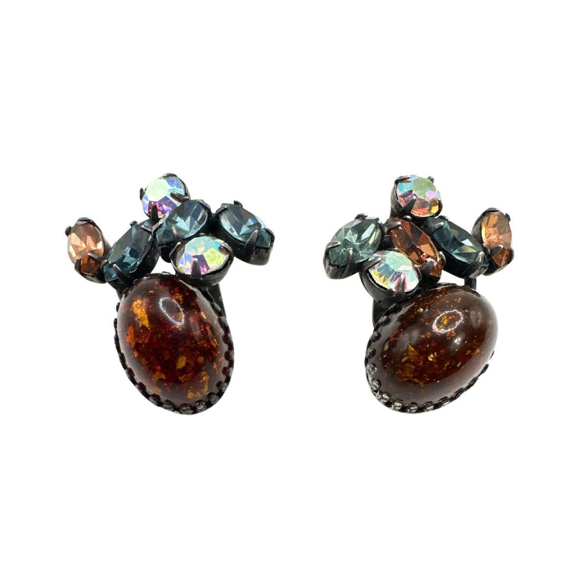 Earring Length: 1:26

Bin Code: E23 / P2

Step back in time with these exquisite Signed Weiss Vintage Multi-Color Glass and Rhinestone Earrings. Crafted with meticulous attention to detail, these earrings showcase a stunning combination of vibrant