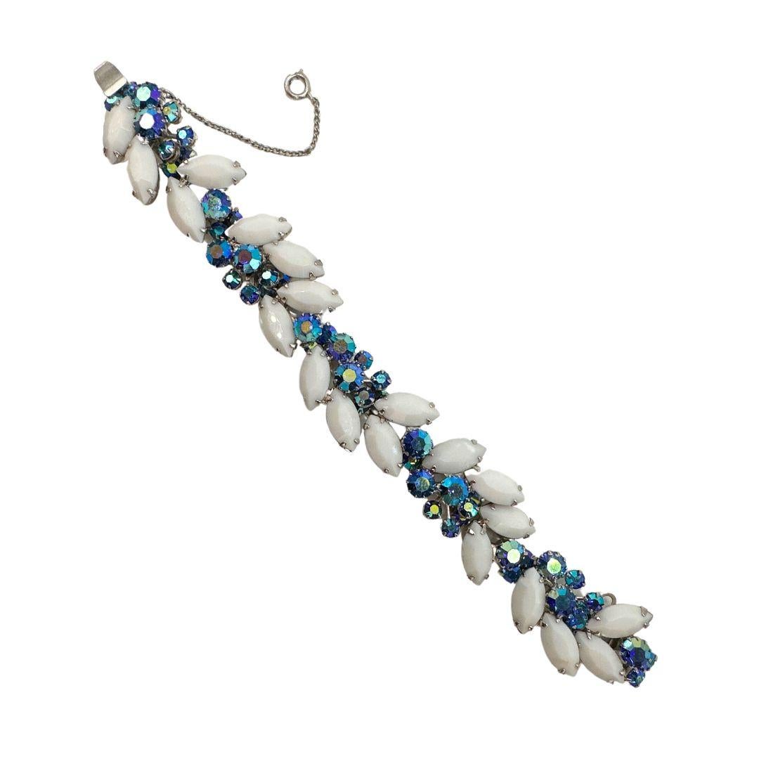 Bracelet Length: 7″

Bin Code: B3 / P3

Experience the allure of bygone eras with this exquisite Antique Vintage Weiss Bracelet. Crafted with delicate white glass and shimmering rhinestones, this bracelet exudes timeless elegance and vintage