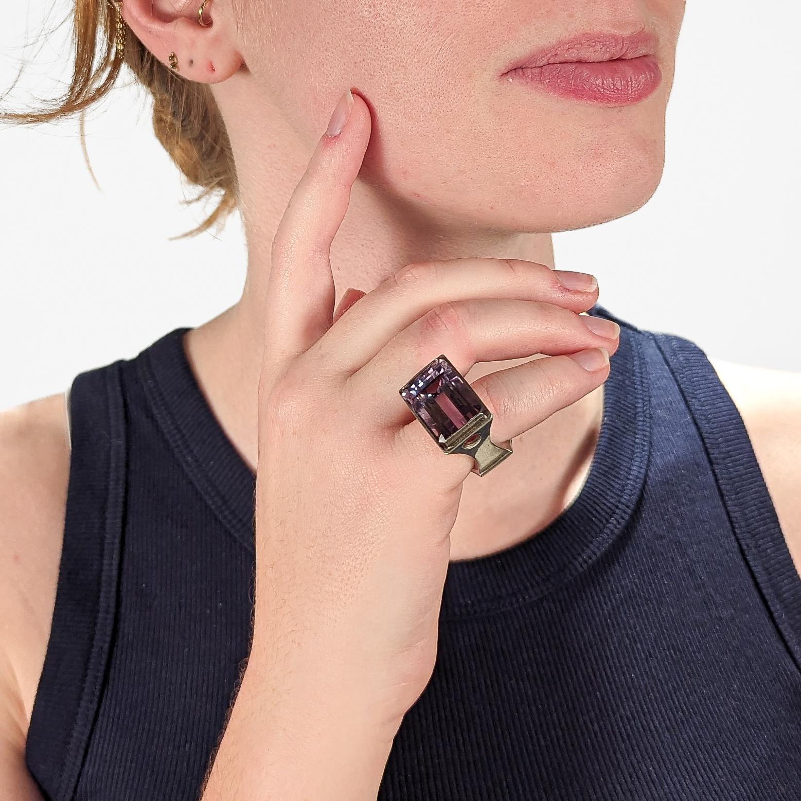 An impressive, signed Wesley Emmons ring.

Emmons was an important jewelry maker in Philadelphia during the middle of the 20th century. He created cutting-edge jewelry for decades, and his long client list included numerous prominent clients such as