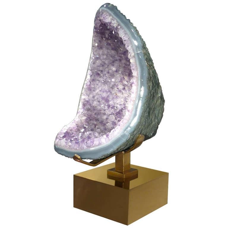 An amethyst sculpture resting on a bronze base by Willy Daro.

Belgium, circa 1970s

In stock.