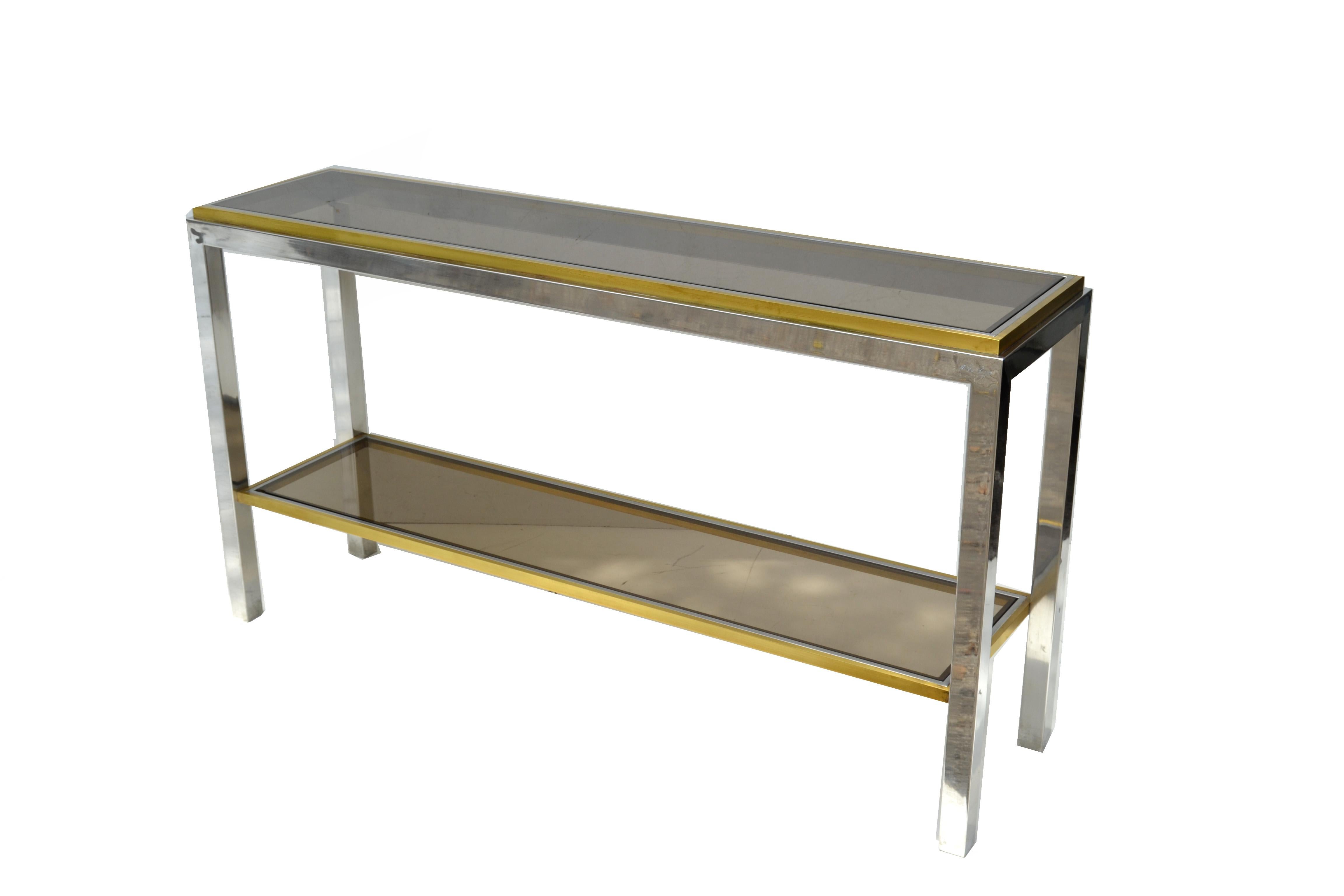 Very elegant two-tier console table signed Willy Rizzo made in Italy, circa 1965.
Sturdy chrome frame with brass inlay and smoked glass tops.
Mid-Century Modern minimalist design for any interior.
  
