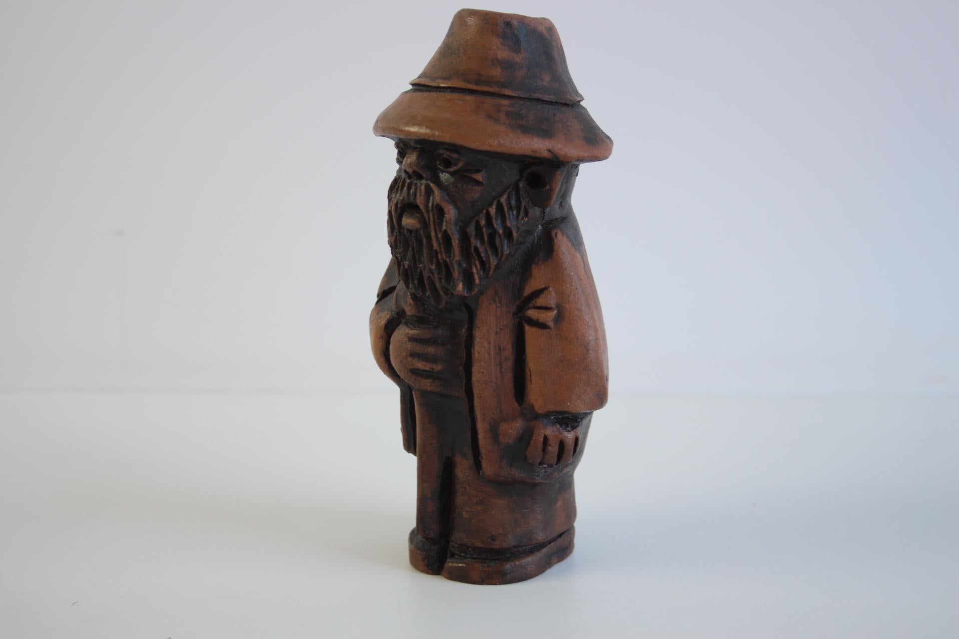 This charming vintage wooden figurine, signed 