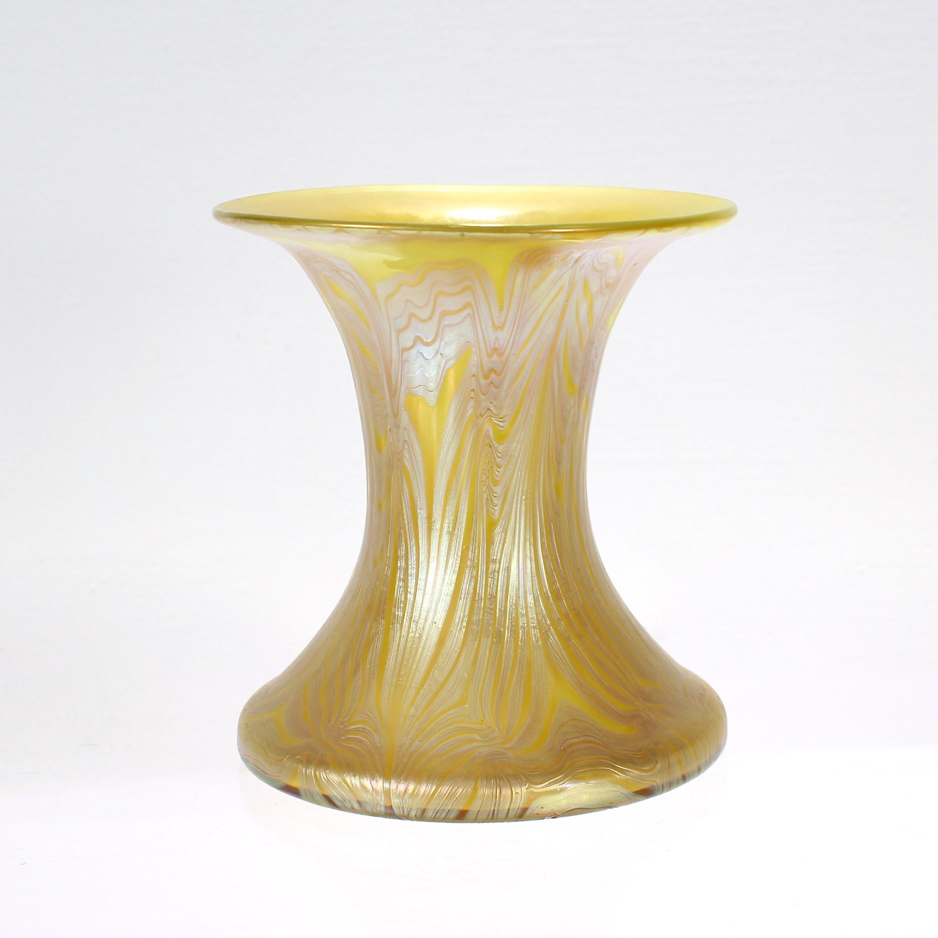 A very fine and rare, signed Austrian Art Nouveau Period art glass vase.

A so-called Phänomen or Phenomenon vase. 

With pulled silver-blue iridescent patterning applied on a yellow ground. 

By Johann Loetz Witwe.

Signed 'Loetz Austria'