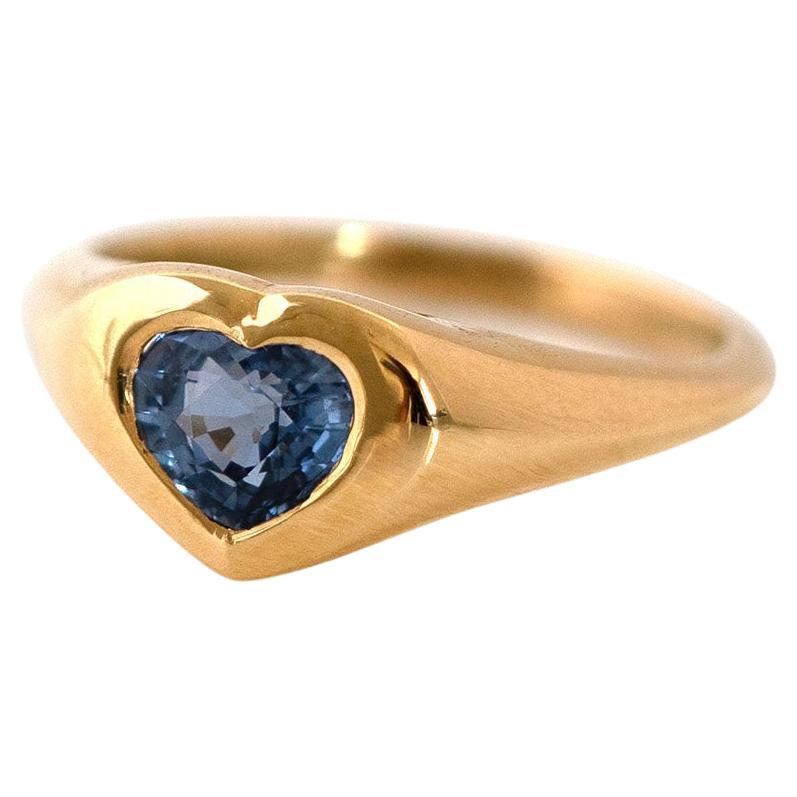 Discover the timeless elegance of our Signet 18ct Sapphire Heart Pink Ring, expertly crafted by Master Goldsmiths in London. Featuring a 0.76ct mixed cut heart-shaped sapphire, known for its durability and stunning deep blue hue, this ring is set in