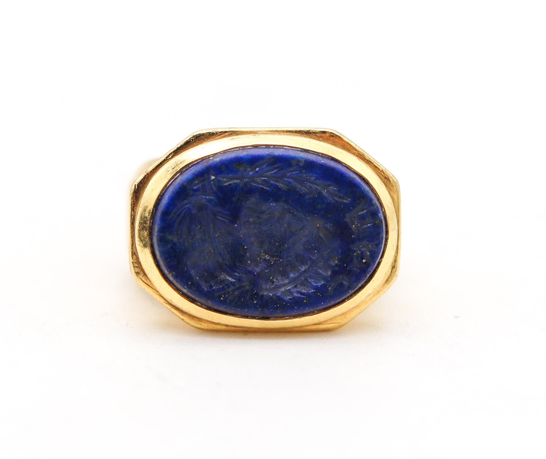 A lapis lazuli intaglio signet ring.

A very bold beautiful piece, crafted in solid 18 karat yellow gold and finished with a delicate ultra-fine satin brushing. This massive revival style signet ring was constructed in a octagonal shape with eight