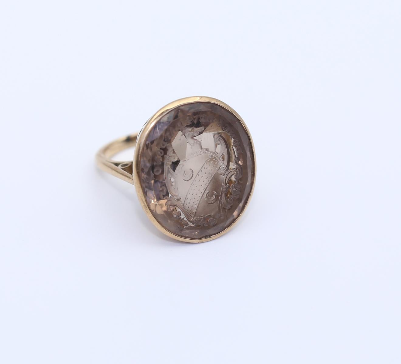 Signet Topaz British Ring 9Ct Gold. Created around 1890.
Huge and fine Antique English topaz signet ring. The top of the Signet has the moto:

“Donec Devs Dat Dono”

The motto could be translated from Latin as 