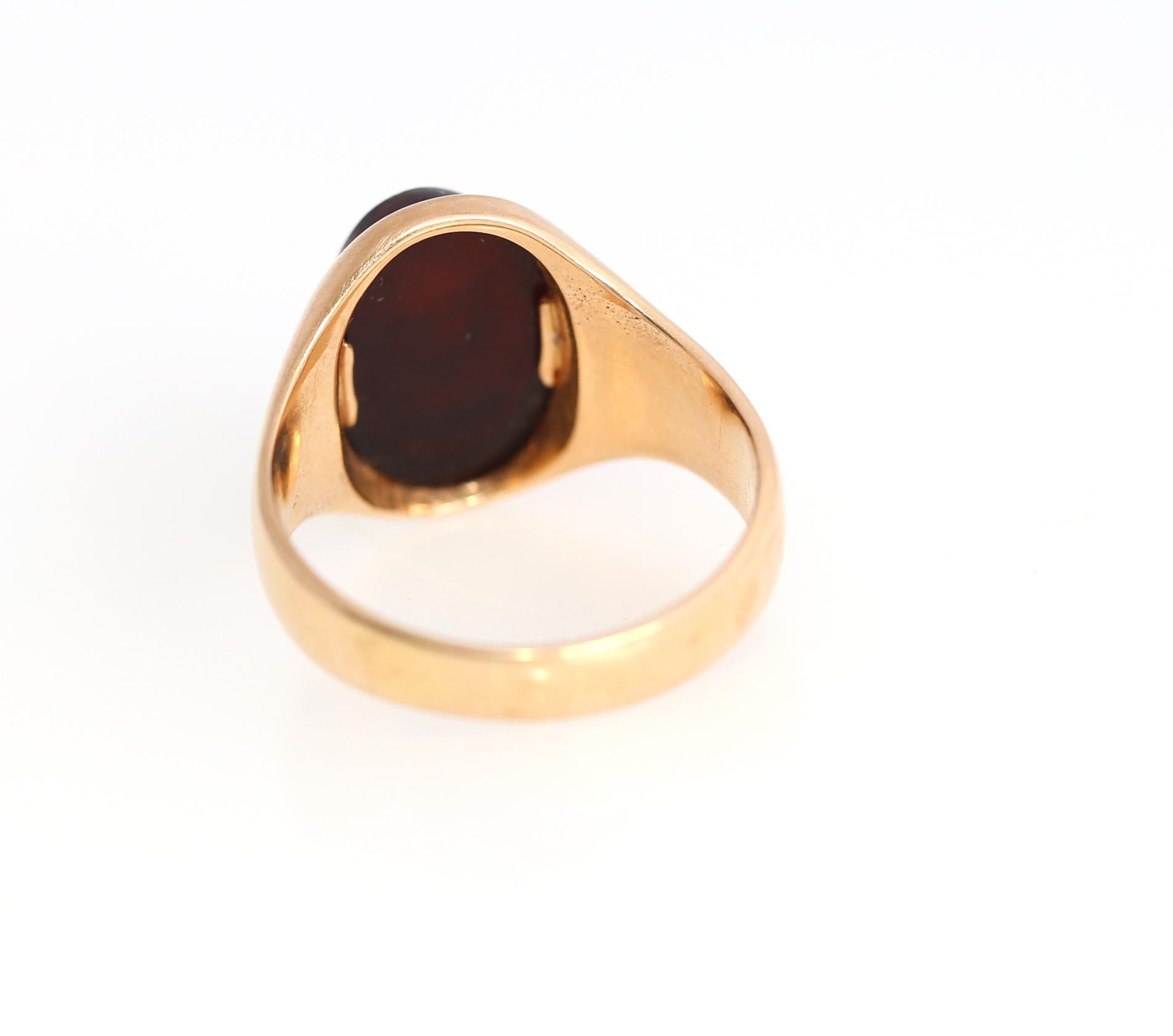 Oval Cut Signet Warrior Carved Red Onyx Gold Ring, 1920