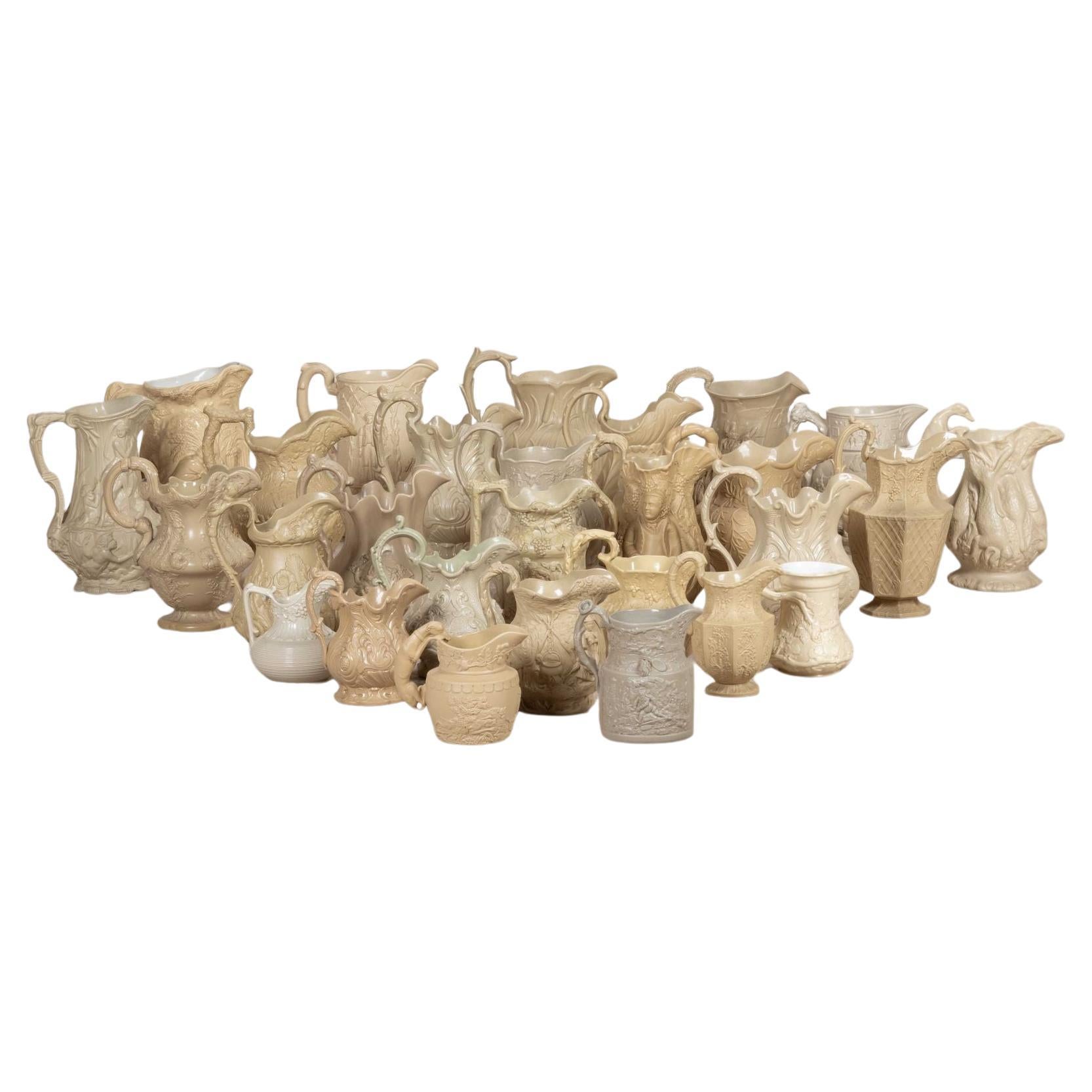 Significant Collection of Victorian Relief Moulded Jugs For Sale