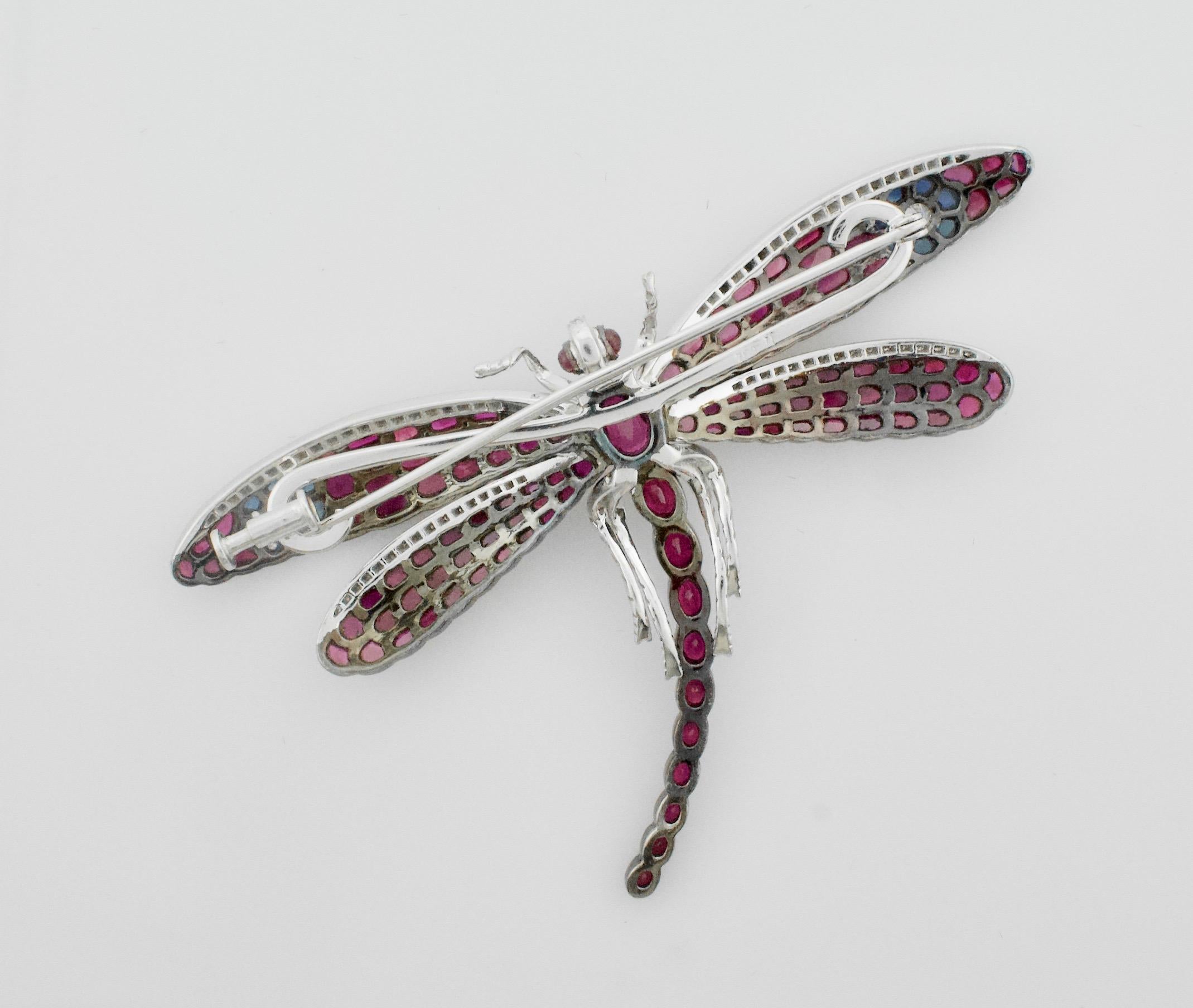 Significant  Dragonfly Brooch with Rubies, Sapphires and Diamonds in 18k 
14 Fancy Cut Sapphires Weighing 2.80 Carats Approximately
115 Fancy Cut Rubies Weighing 17.00 Carats Approximately
81 Round Brilliant Cut Diamonds Weighing .55 Carats