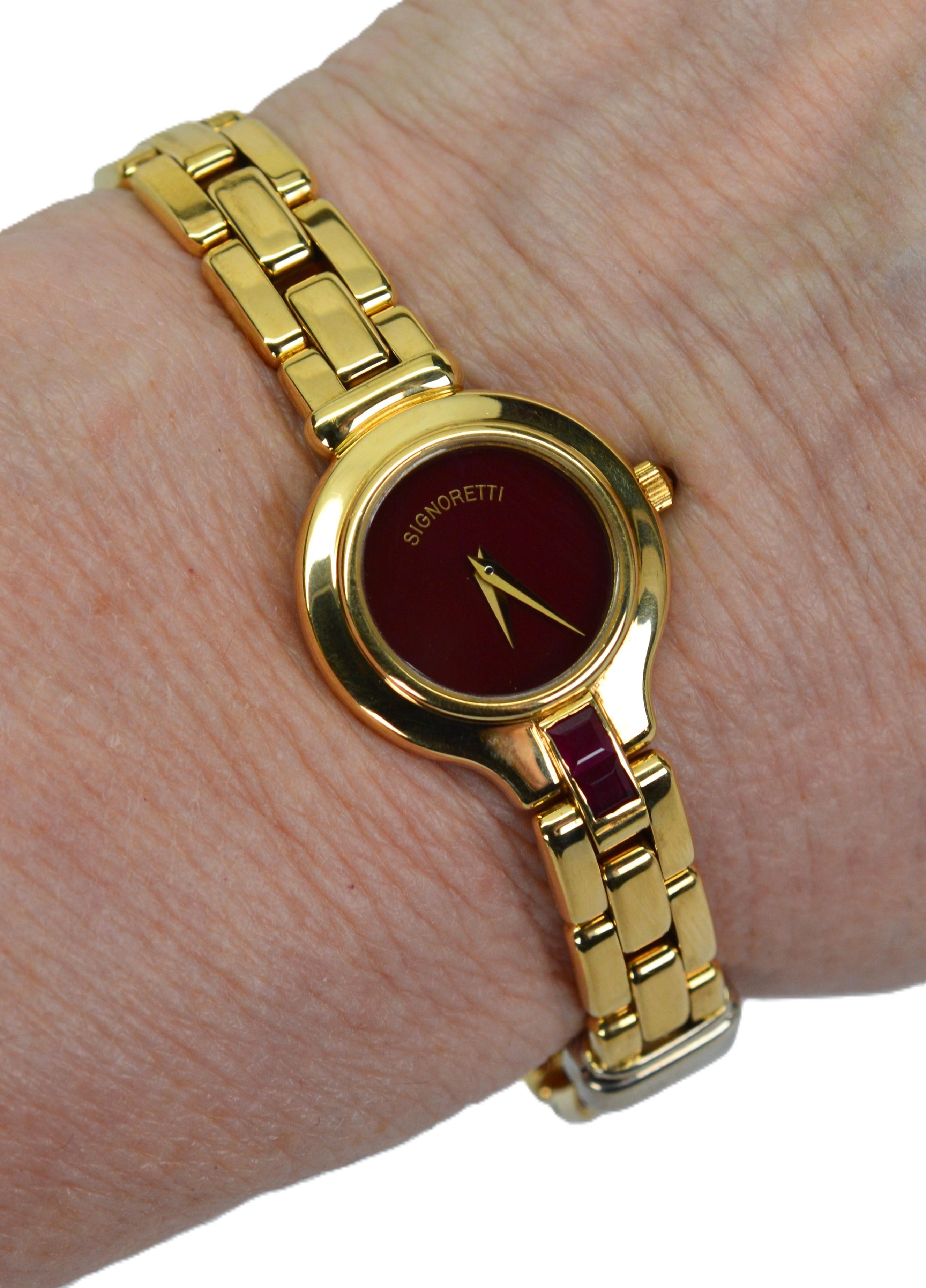 By Italian designer, Signoretti, in highly polished 18 karat yellow gold, this sophisticated attractive bracelet wristwatch hugs the wrist with classic style and exudes a timeless casual elegance. Versatile in both design and color, the watch is
