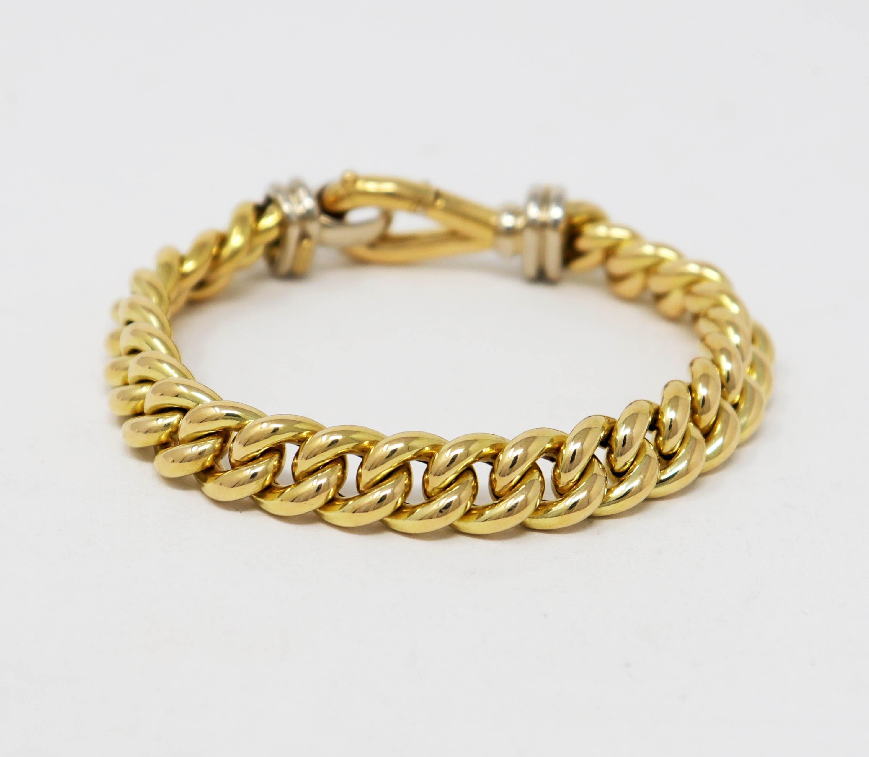 Stunningly sophisticated gold curb chain bracelet will stand the test of time. The classic design hugs the wrist and exudes a timeless elegance. Versatile in both design and color, this bracelet can be paired with other bracelets for a more modern