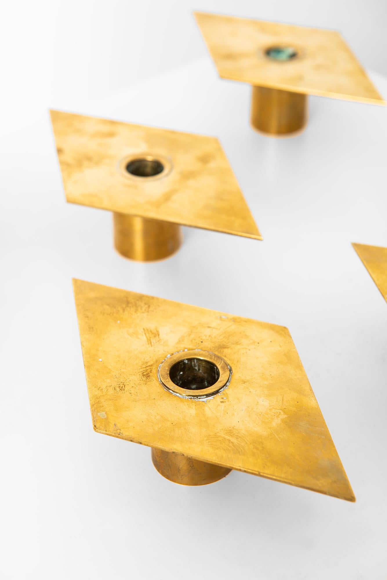 Set of 6 brass candlesticks model Rhomb designed by Sigurd Persson. Produced by Sigurd Persson Design in Sweden.