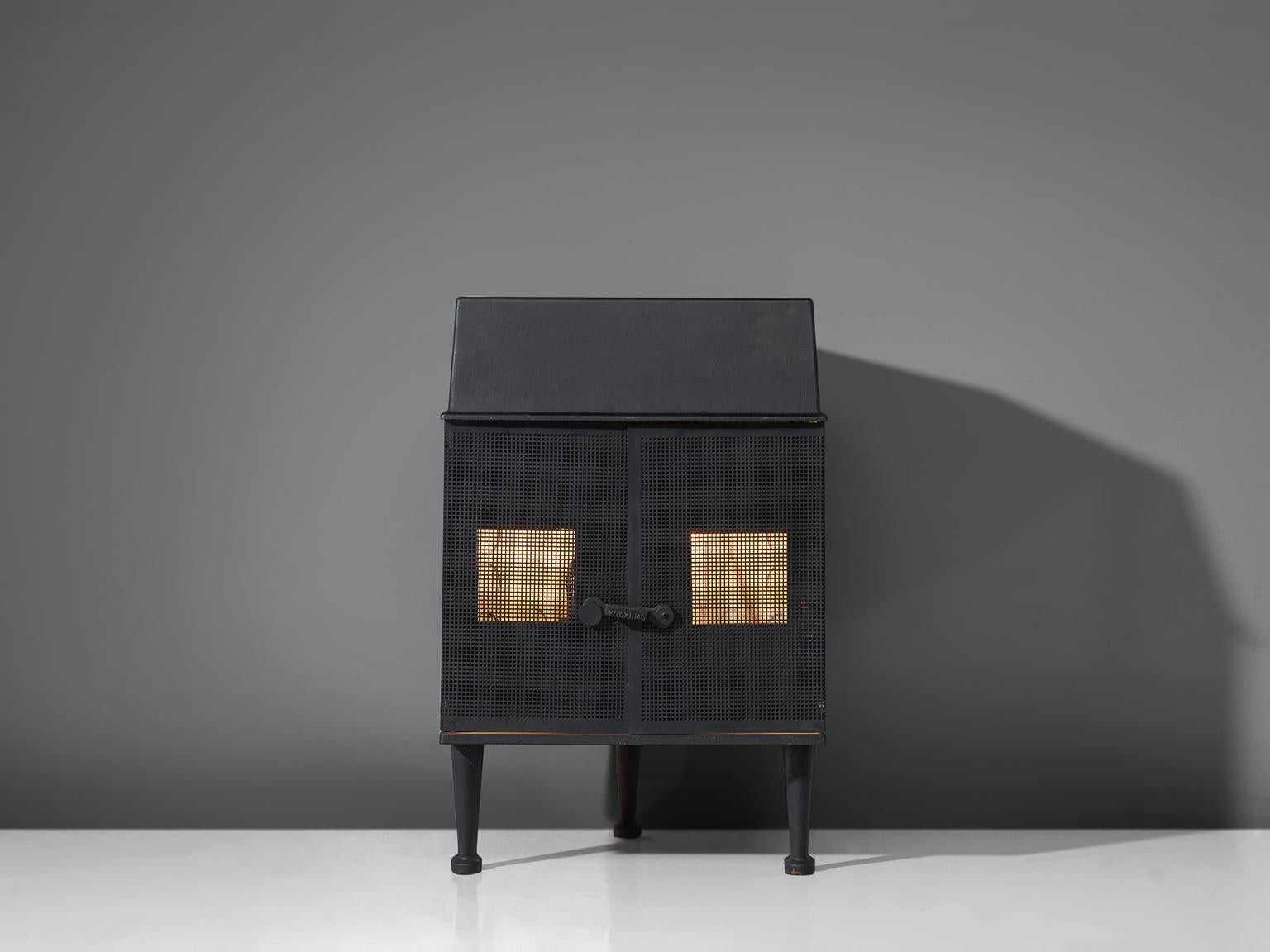 Sigurd Persson for Kockums, woodburning stove, black cast iron, Sweden, 1960s

Original woodburning stove designed by Sigurd Persson in the late 1960s-1970s. The fireplace is decorated with circles on the side. The high legs lift the stove from