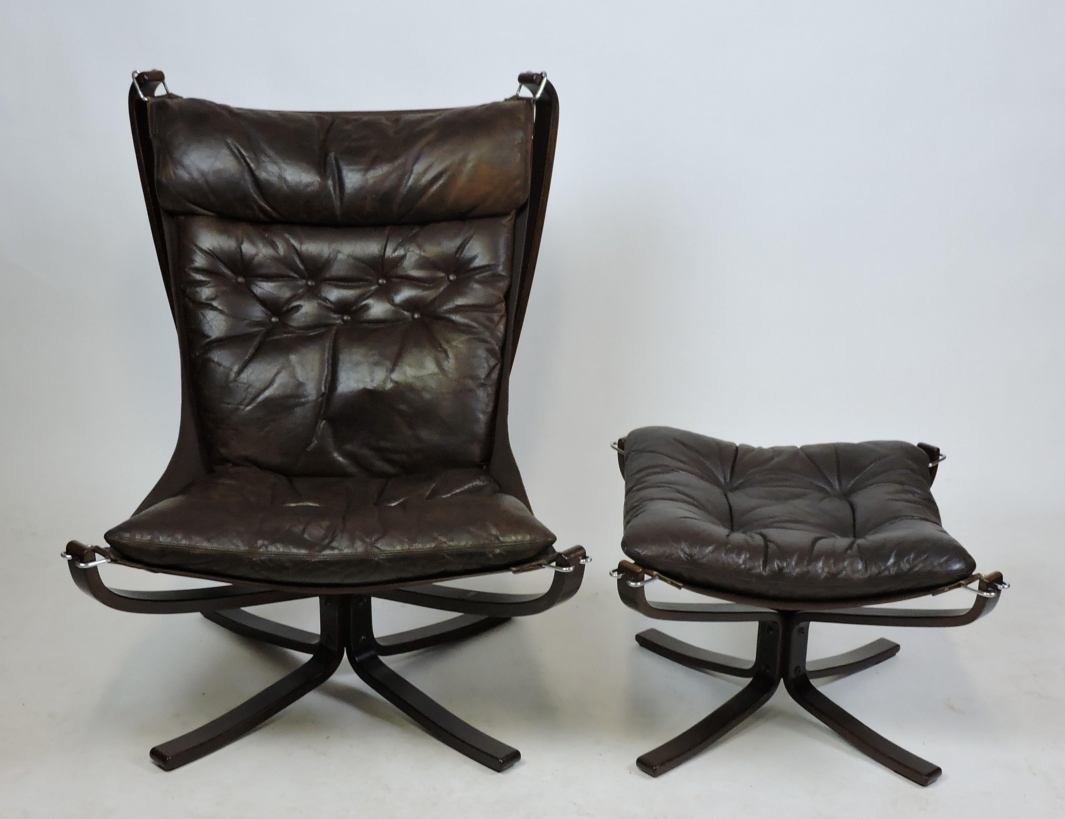 Sleek and sexy falcon high back lounge chair and ottoman designed by Sigurd Ressel and made in Norway by Vatne Mobler. This very comfortable chair has a bentwood frame made of rosewood stained beech with a dark chocolate brown leather cushion that