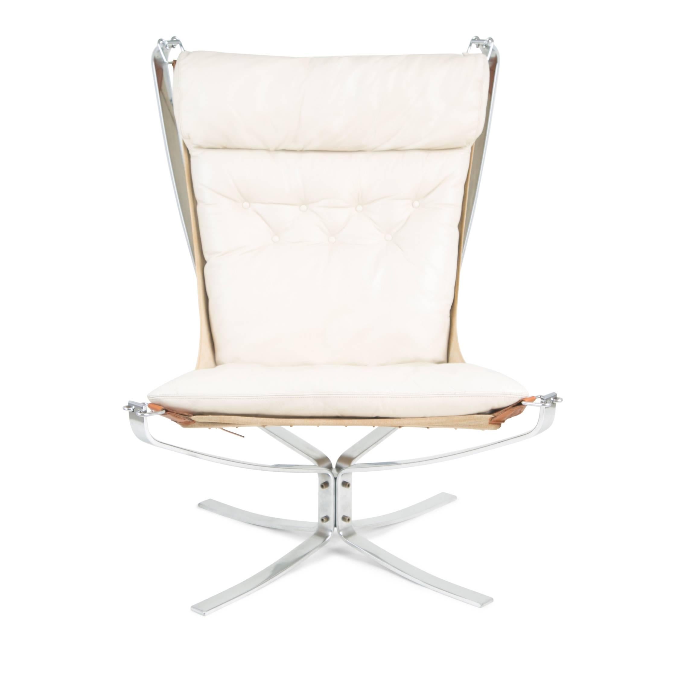 Elegant high back version of the Falcon chair by Sigurd Ressell for Vatne Møbler. This iconic example of Norwegian design features a chrome-plated X-base and frame with tufted white leather seats supported by a suspended canvas sling.

This lounge