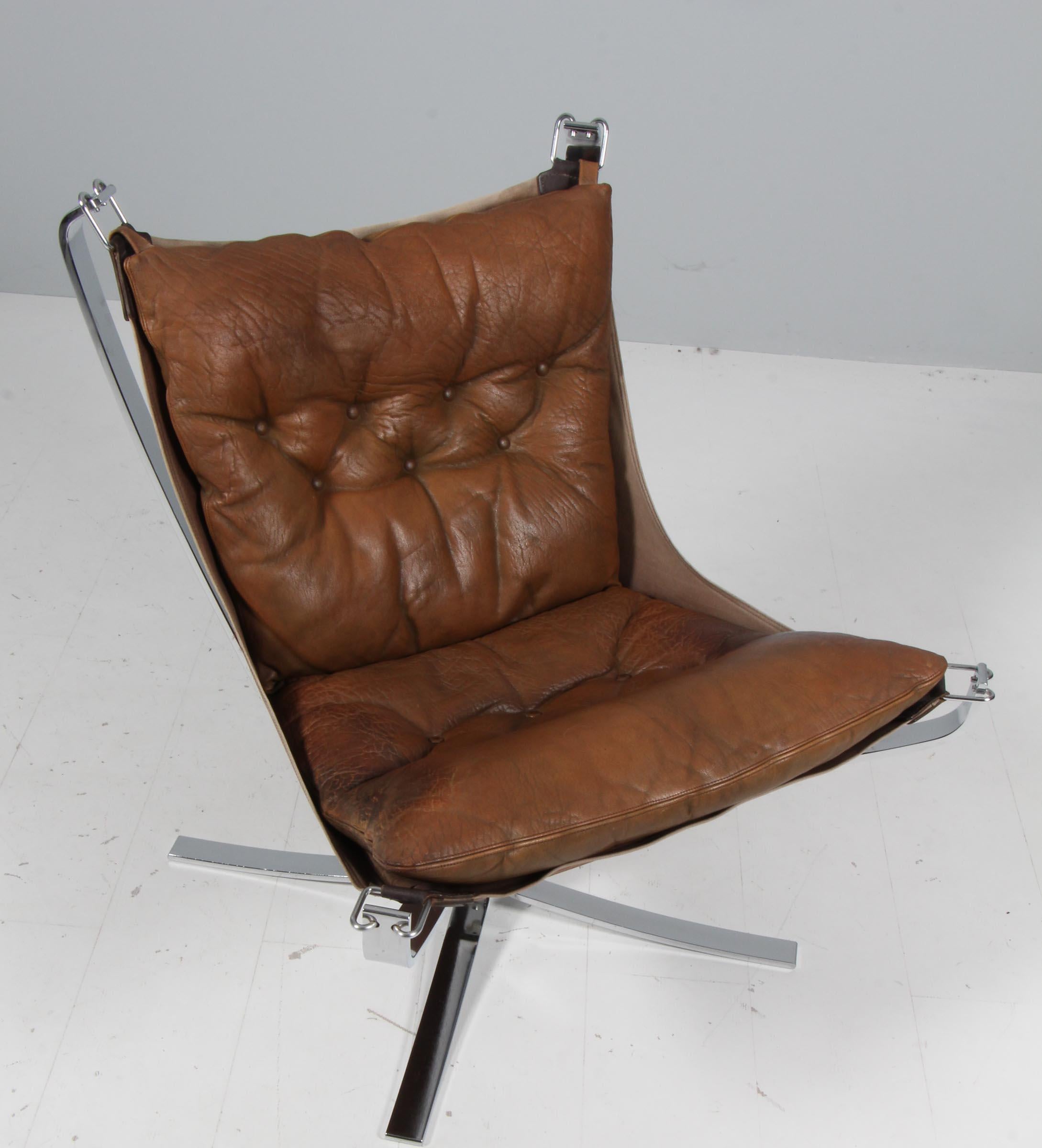 Sigurd Ressell lounge chair upholstered with patinated leather.

Frame in steel.

Model Falcon, made by Vatne Møbler.