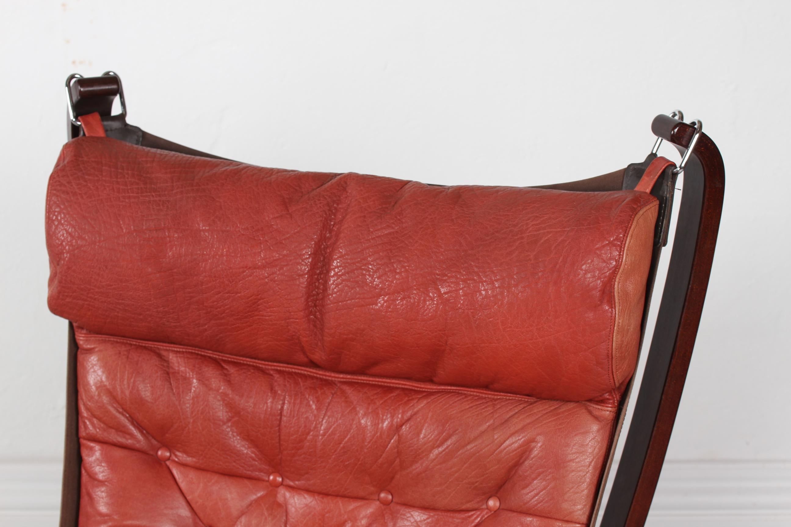 A pair of Falcon easy chairs designed by Sigurd Ressell. Manufactured by Vatne Møbler Norway in 1970s
The chairs have got a frames of dark stained steam bend wood and the cushions are upholstered with genuine brick red/red brown leather in very