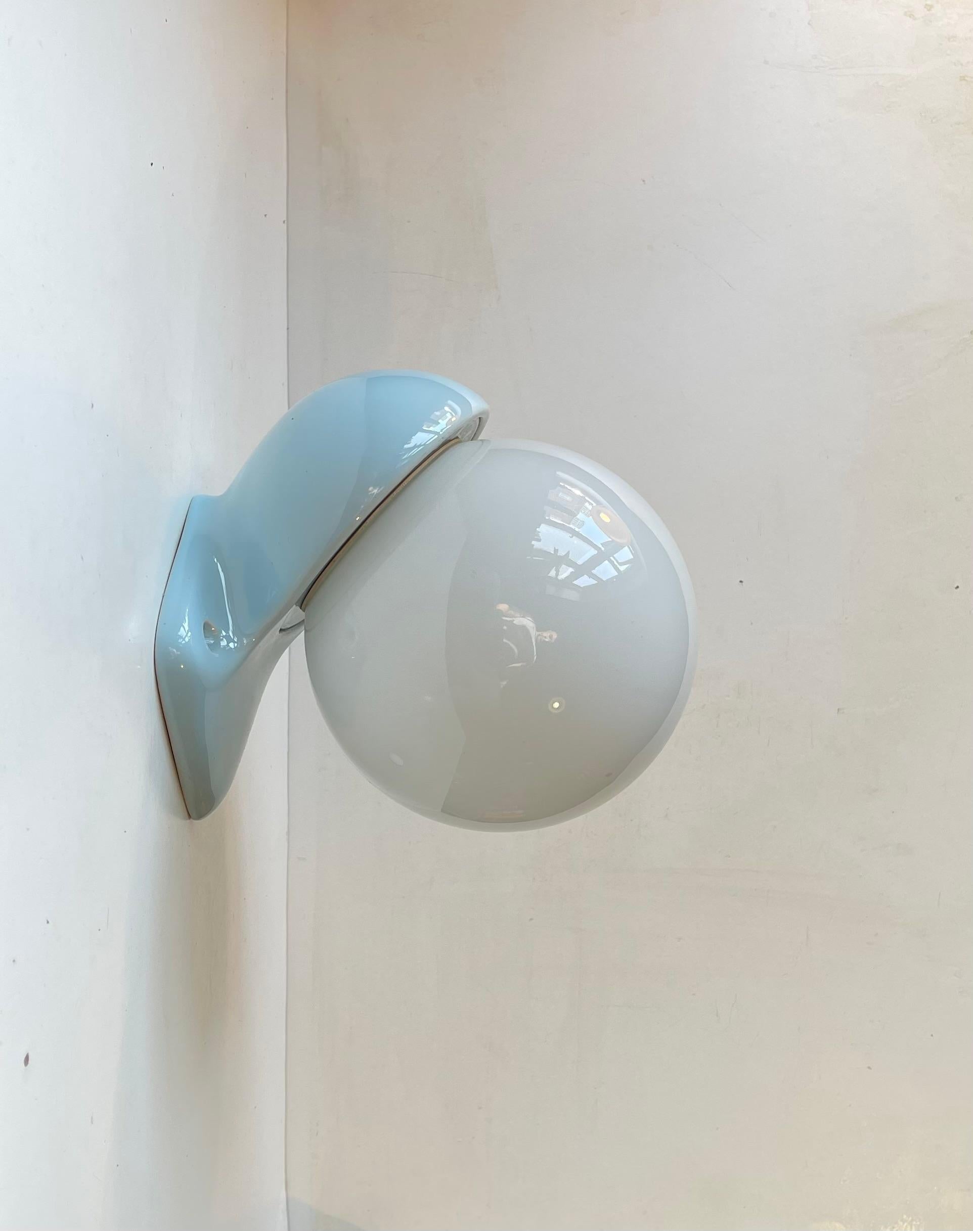 Spherical Wall sconce model 6030 suitable as bathroom or outdoor lighting. Designed by Prince Sigvard Bernadotte for the swedish company Ifö during the 1960s. Baby blue glazed porcelain mount set with a white opaline glass shade. 2 way mount -