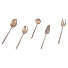 Sigvard Bernadotte "Scanline" brass flatware. Five pieces of serving utensils