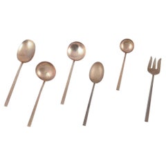 Sigvard Bernadotte "Scanline" brass flatware. Six pieces of serving utensils.