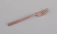 Sigvard Bernadotte 'Scanline' cutlery set in brass. Eight cake forks.