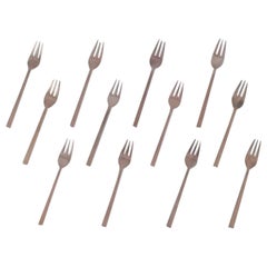 Sigvard Bernadotte 'Scanline'. Set of twelve cake forks in brass.