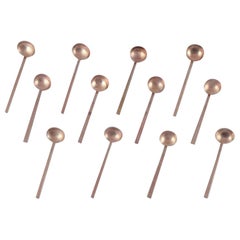 Sigvard Bernadotte 'Scanline'. Set of twelve jam/sugar spoons in brass.