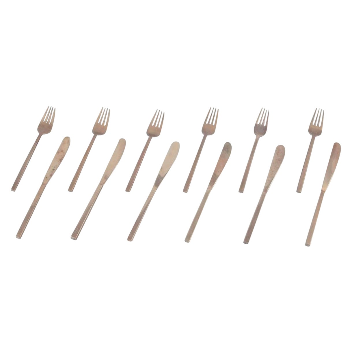 Sigvard Bernadotte "Scanline" Six dinner knives and forks in brass.
