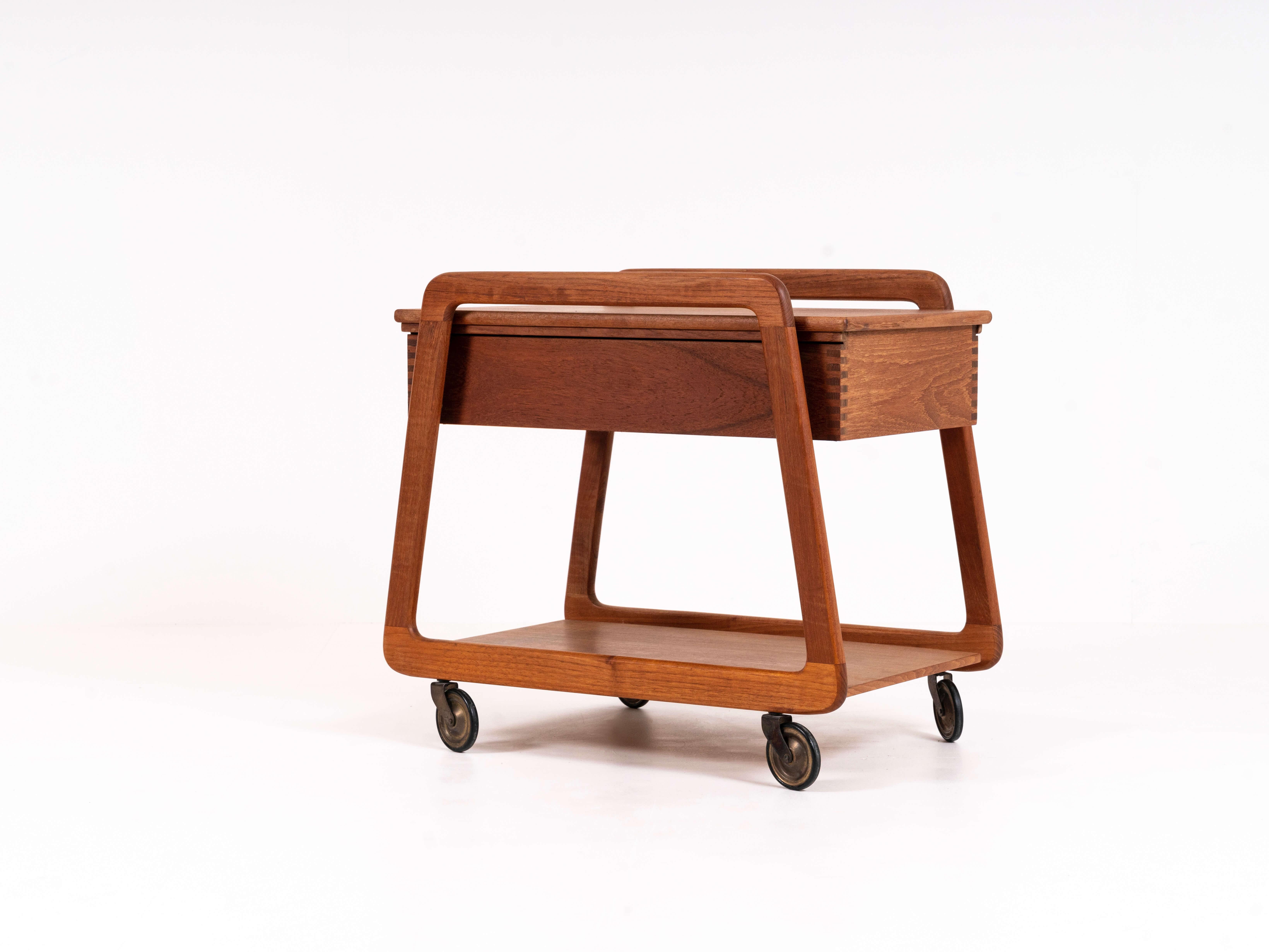 Charming Sika Møbler serving trolley in teak from Denmark in the 1960s. This trolley can swivel and is very practical. It has a drawer on the inside with boxes, schip probably tells you this originally is a sewing trolley. Very practical to use as a