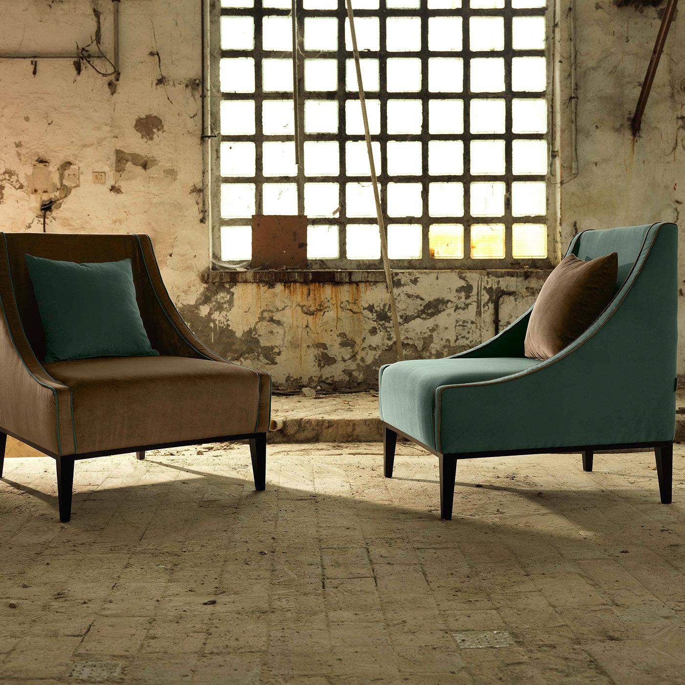 An effortless combination of comfort and style, this armchair will add sophistication to an elegant home, with its clean lines and harmonious volumes. The polyurethane-padded frame is covered in powder-blue Dacron that provides a modern appeal to