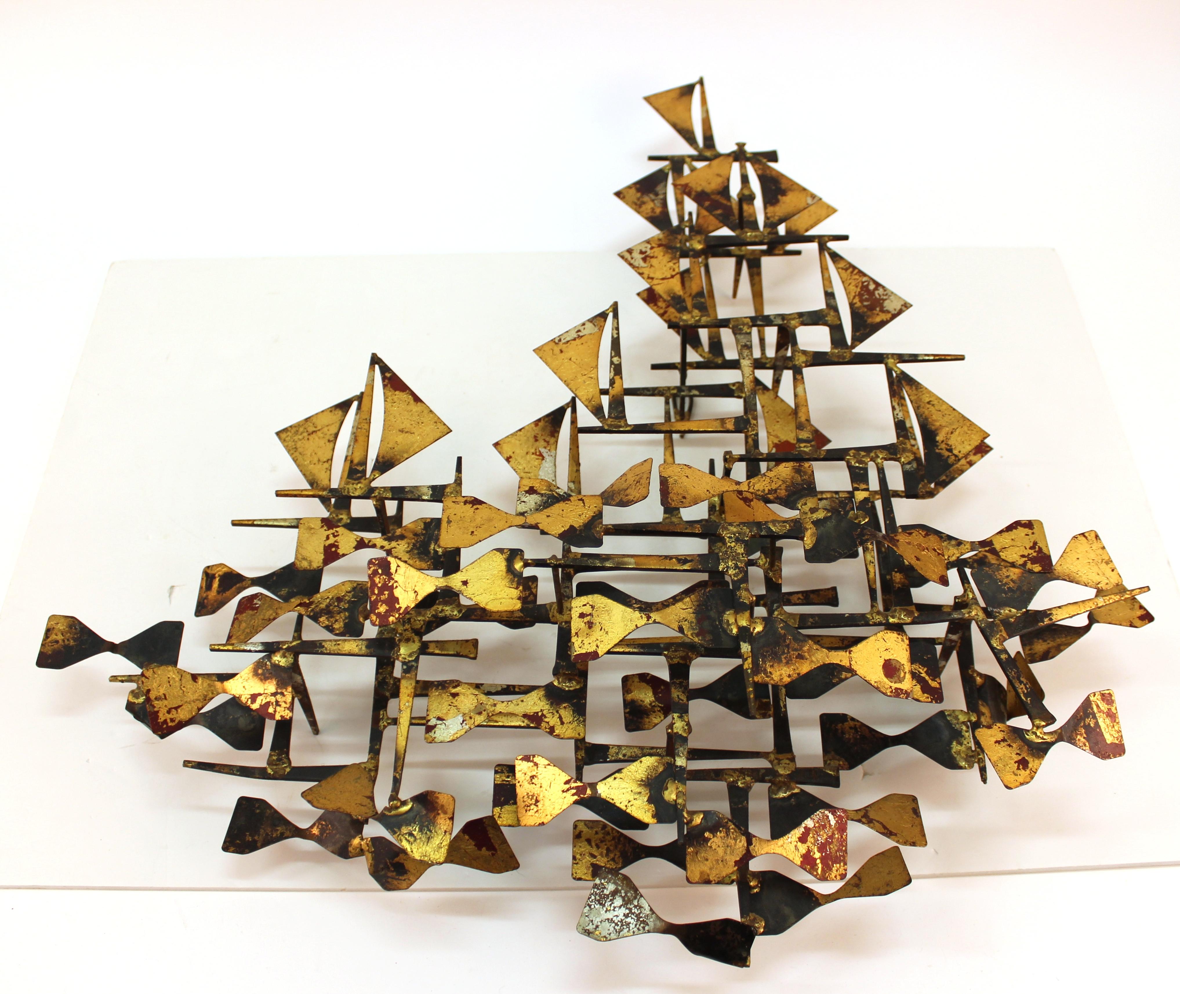 Brutalist abstract wall sculpture in welded metal with a gilt patina, created by American sculptor and designer Silas Seandel (b. 1937). The piece was made in the United States during the 1970s-1980s and is in good vintage condition.