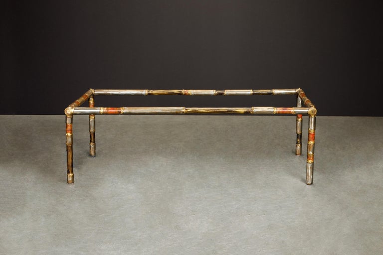 A rare signed and dated Silas Seandal coffee table comprised of a mix of raw solid metals including brass, bronze, steel and copper which have been applied by use of heat treatments and acids that Seandel has developed. All the colors on this piece