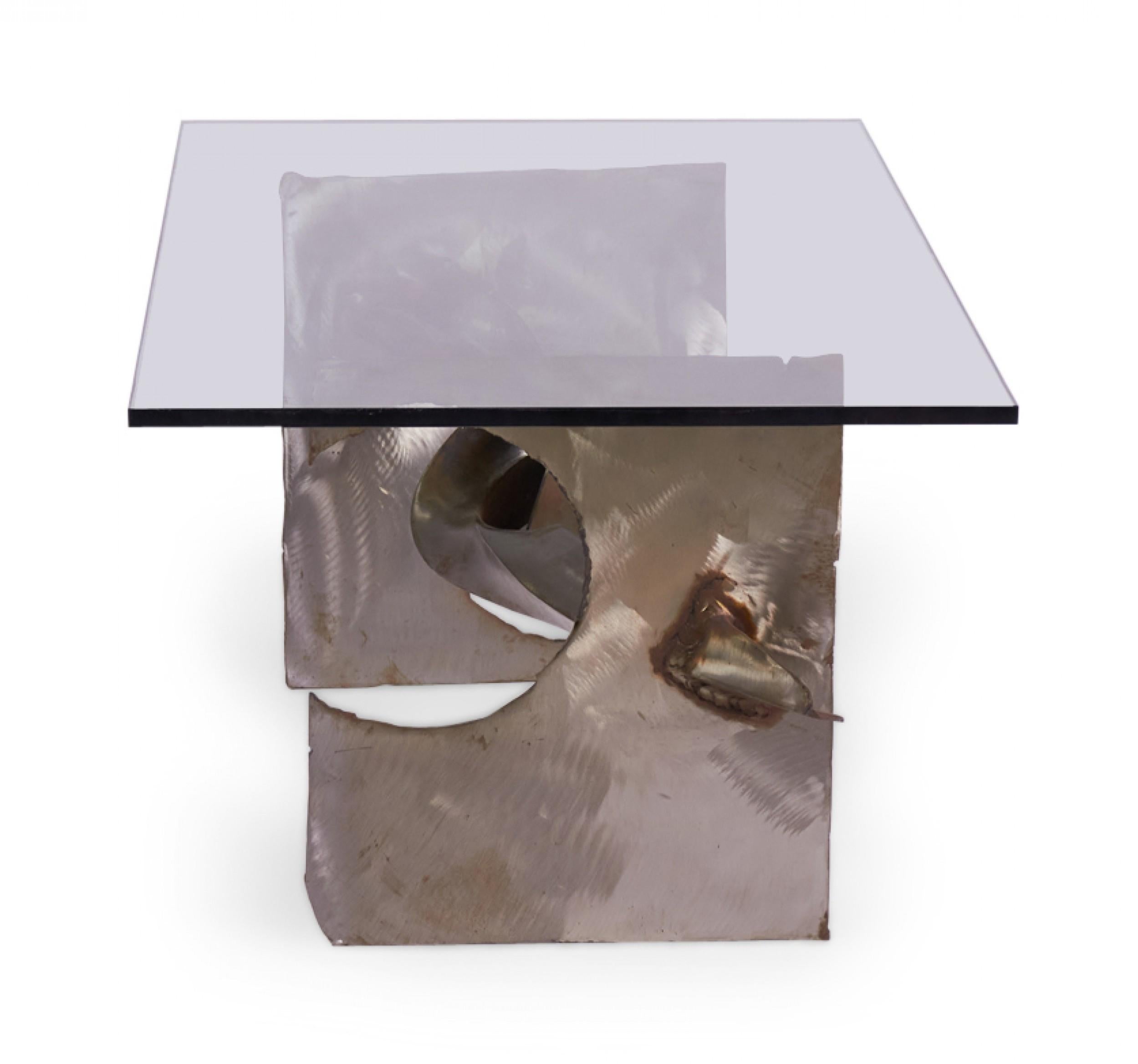 American Mid-Century Brutalist (1974) 'Tortured' ribbon steel coffee table with a rectangular clear glass table top. (signed, SILAS SEANDEL, '74)