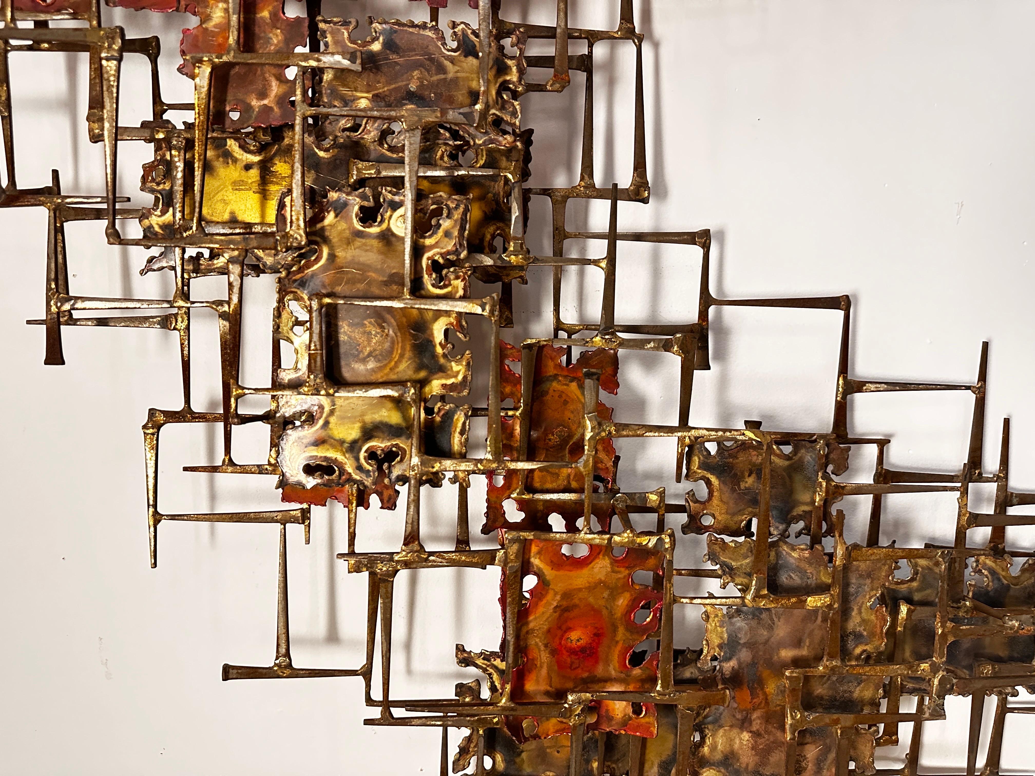 Constructed of primitive nails and patinated panels, this is an epically large example signed by the artist on reverse. 

