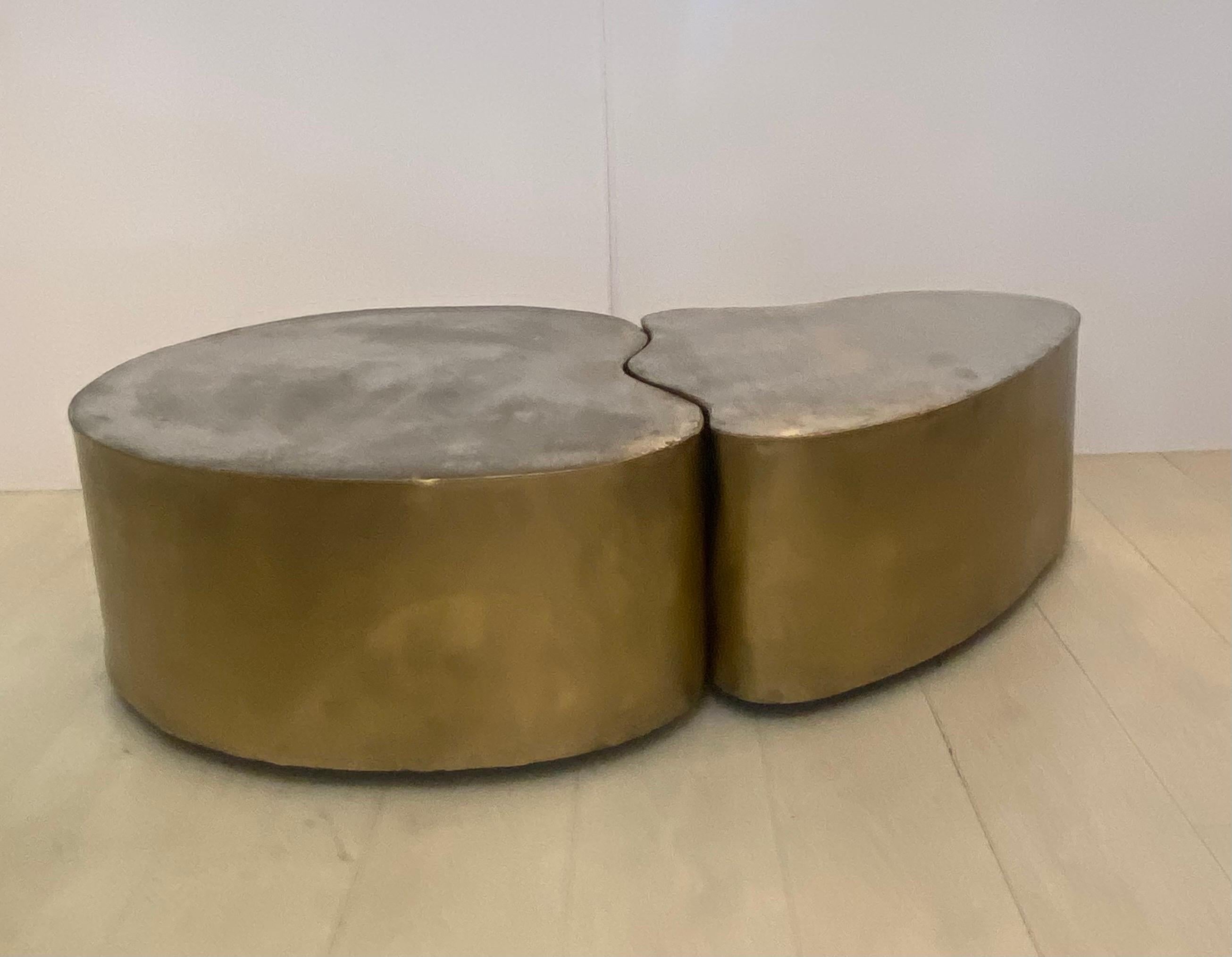 Two rare freeform patinated brass bases with brushed steel tops on Hidden castors .signed Silas Seandel 1972 .signed on the side of the smaller table. Size of larger table 33 1/2” x 30 1/2” x 13” tall… Size of smaller table 32 1/2” x 23” x 13” tall.