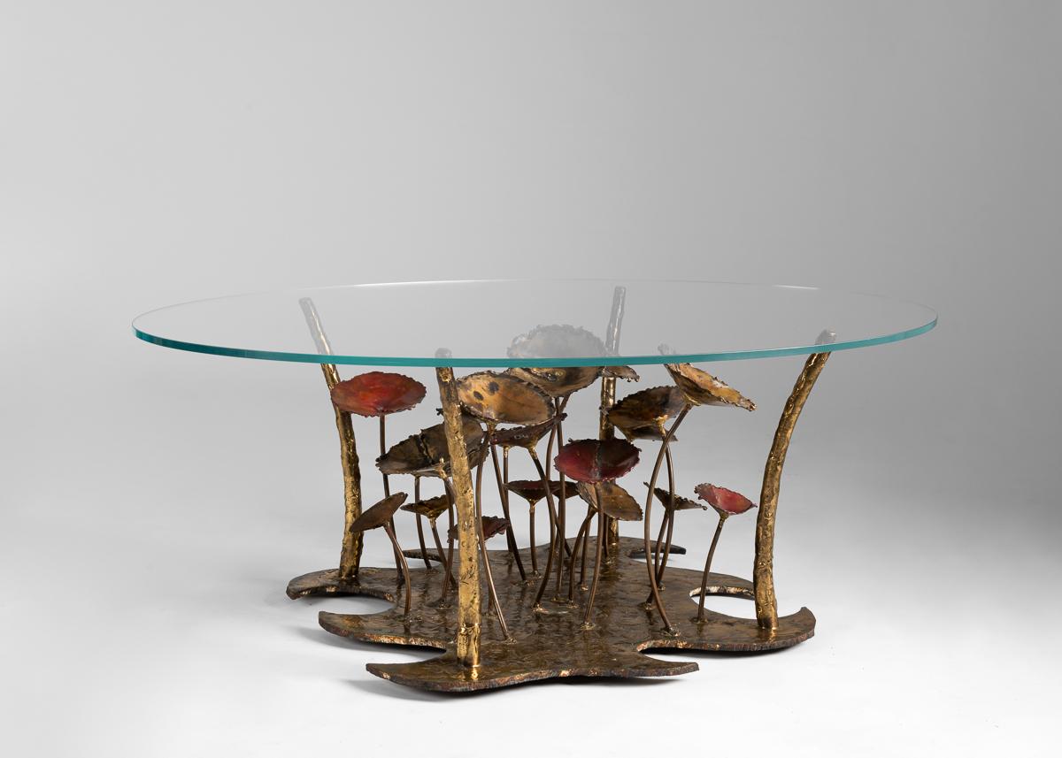A playful table in an assemblage of metals and glass.