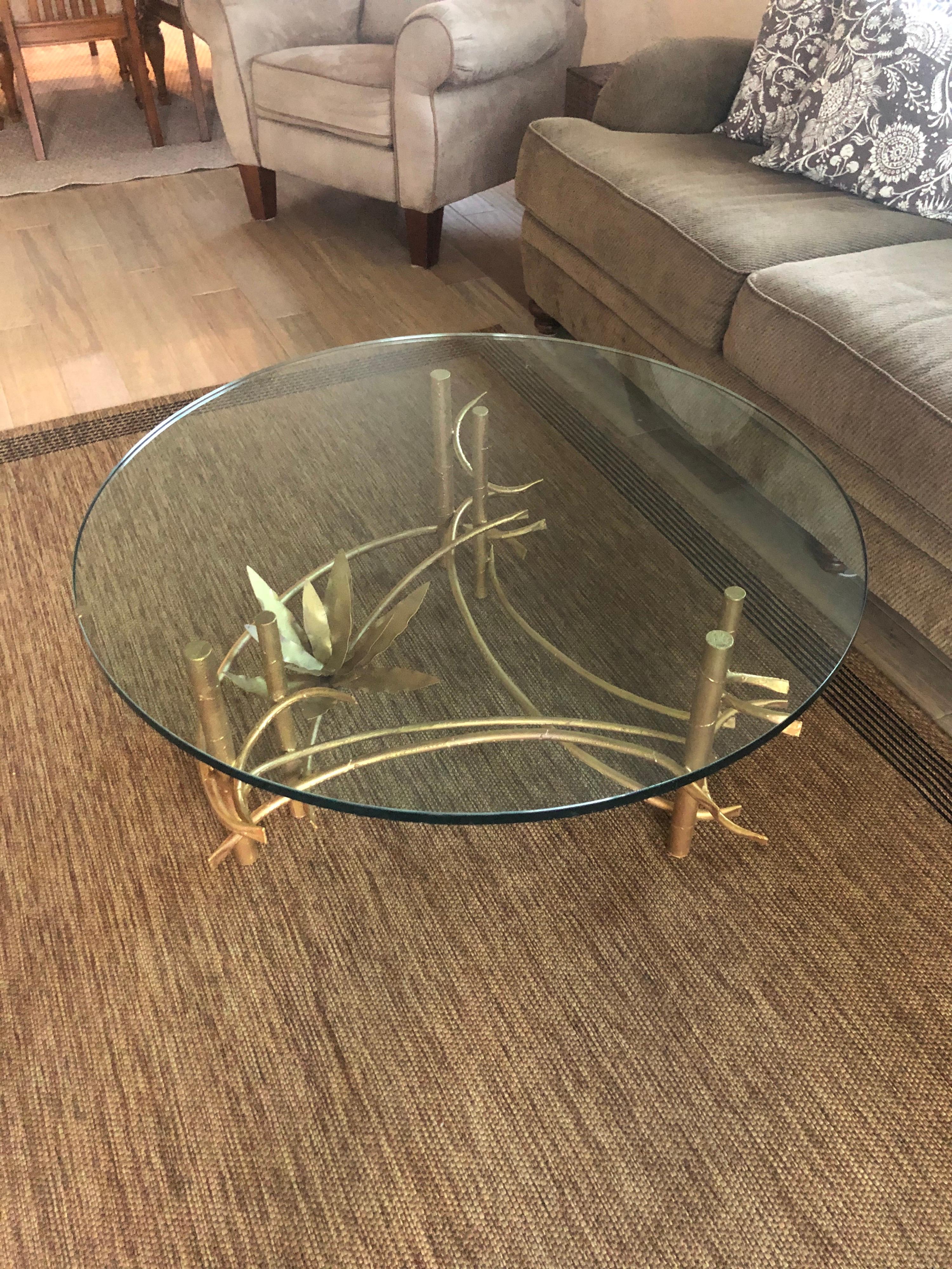 Silas Seandel lotus coffee table. Handcrafted by the artist. Decorative Asian feel to this floral sculptural base. Thick round glass top to table. The glass is 3/4