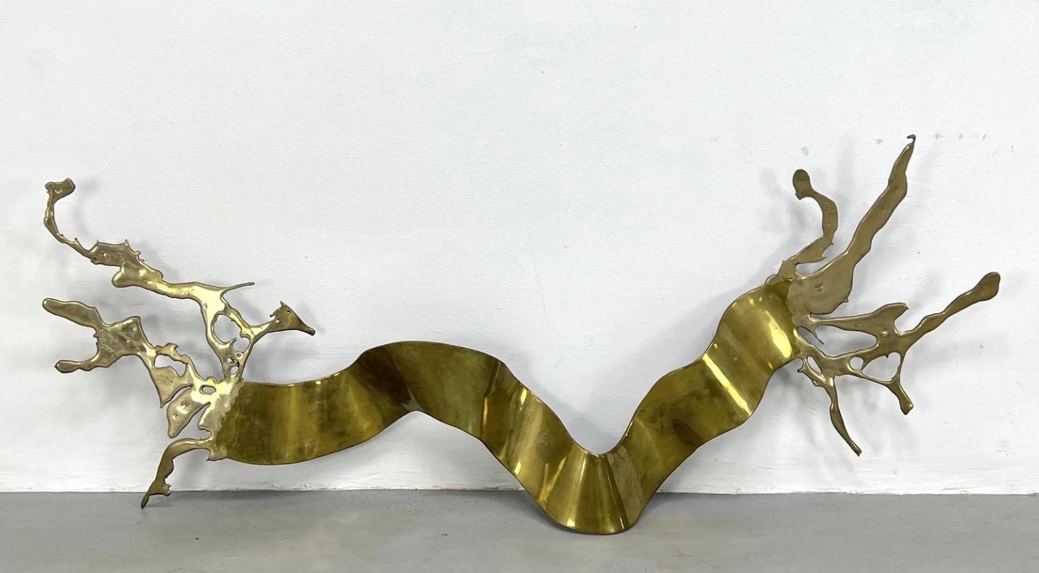 This fascinating Silas Seandel 'Ribbon' wall-mounted sculpture is constructed from brass and formed into an organically abstract art piece in a large 63