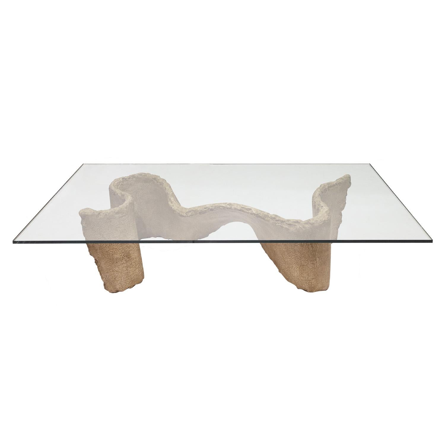 Coffee table with organic shape base in cast solid resin to resemble concrete with thick glass top by Silas Seandel, American 1970's (signed “Silas Seandel (C)” on base). This series in cast resin was made for a special collection shown at