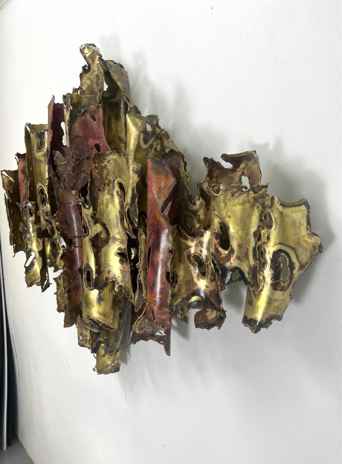Extremely rare, important and large mixed metal wall hanging by metal artist and furniture designer, Silas Seandel. Torched Copper and Brass Curved Elements. Brutalist Modern Design. Signed and dated '74. Dimensions: H: 39 inches: W: 53 inches: D: