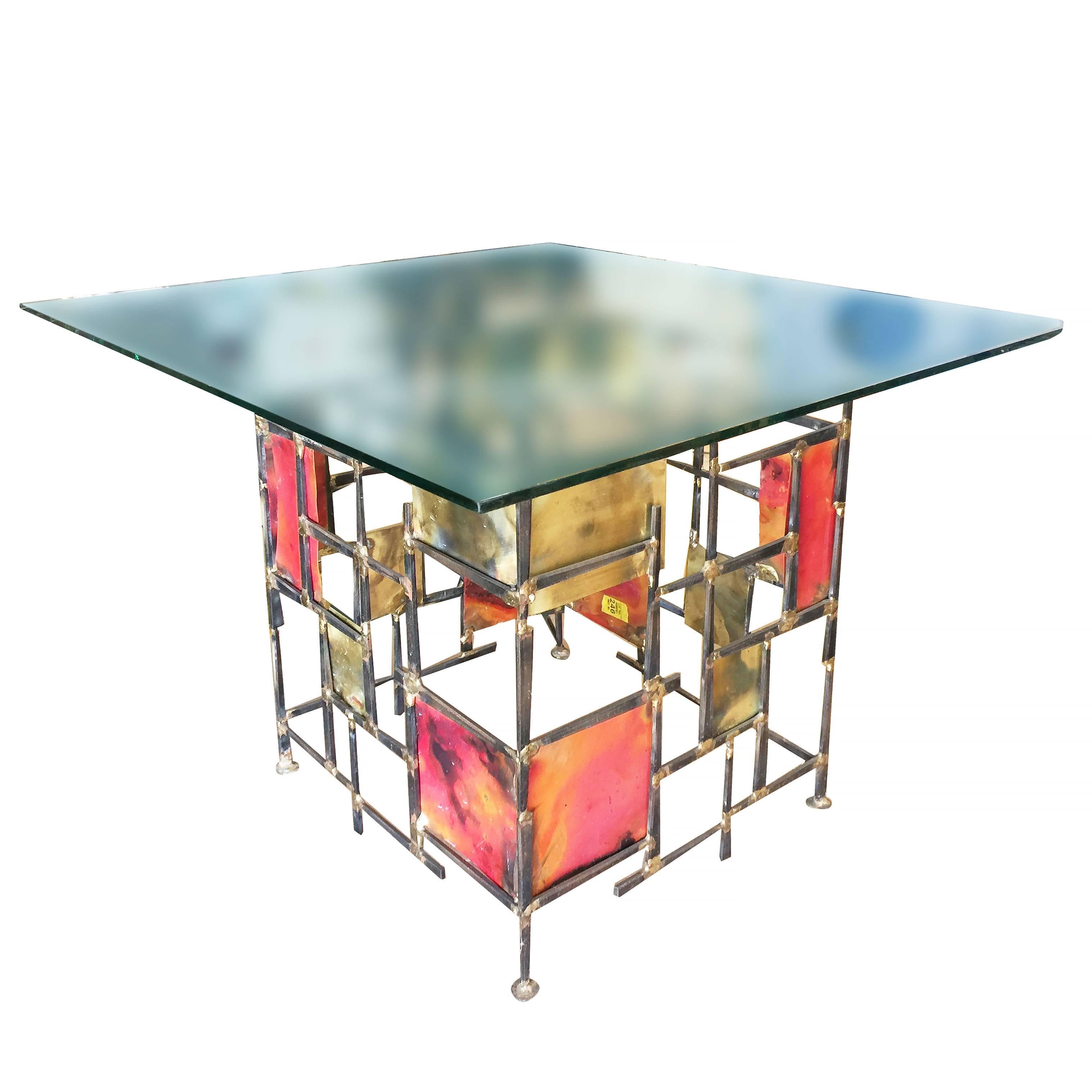 Silas Seandel style Brutalist mixed metal nail side table with glass top. 

The table features a sculptural base made with welded nails and enameled flame cut steel piece complete with glass top.