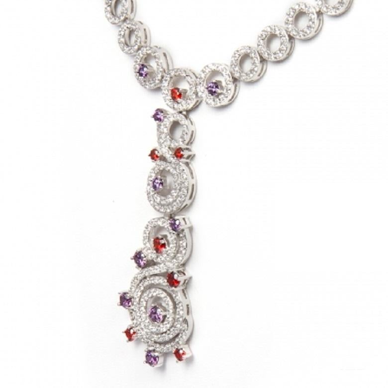 - 950 Siledium silver
- Exclusive dual natural rhodium and palladium plating
- Set with exclusiveFeri Swan cut lab stones
- Hypoallergenic 
- Colour: white, amethyst and garnet
- Part of the Bridal Lines
- Dimension: 18