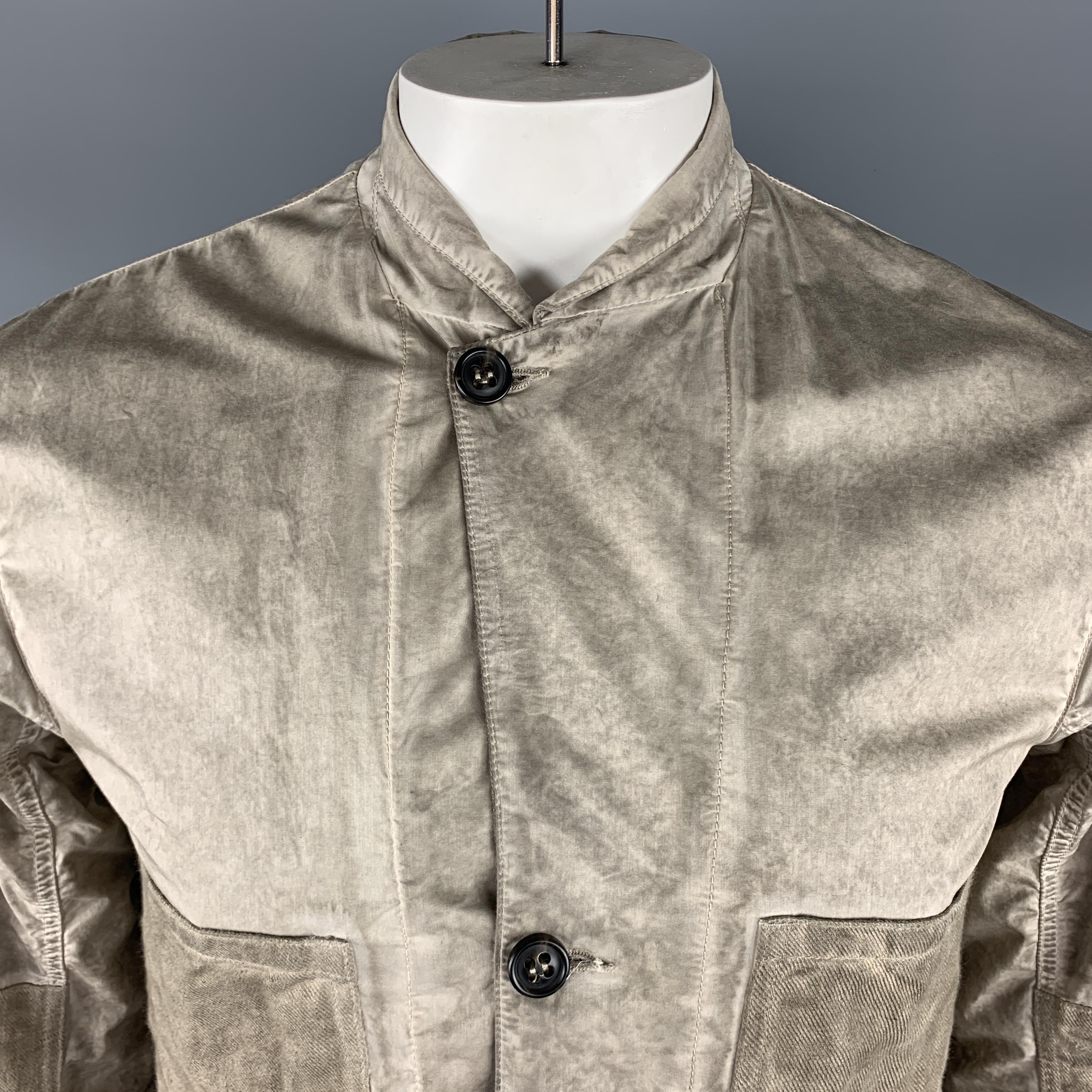 SILENT by DAMIR DOMA jacket comes in a taupe distressed cotton blend featuring a notch lapel style, two oversized canvas patch pockets, elbow patches, and a buttoned closure.
 
Very Good Pre-Owned Condition.
Marked: L
 
Measurements:
 
Shoulder: