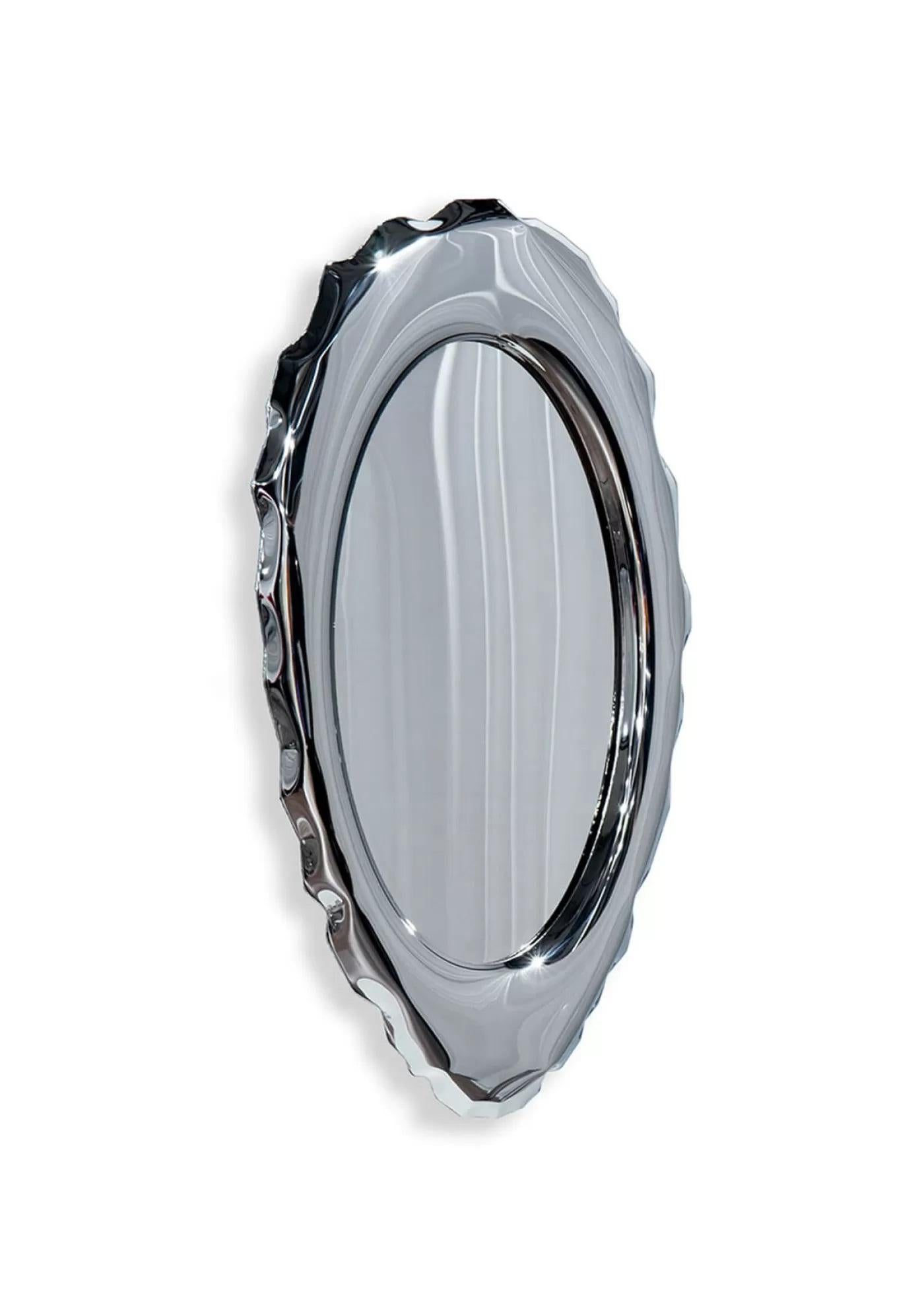 Silex stainless steel wall mirror by Zieta
Dimensions: D 6 x W 75 x H 124 cm 
Material: Mirror, stainless steel.
Finish: Polished.
Also available in colors: stainless steel, or powder-coated.


SILEX is an art form and a reference to the archetypal