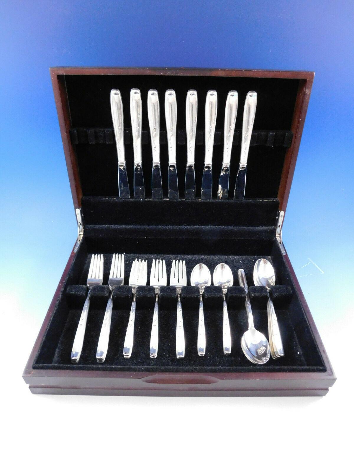 Silhouette by International sterling silver flatware set, 40 pieces. This scarce pattern was introduced in the year 1957. This set includes:

8 knives, 9 1/4