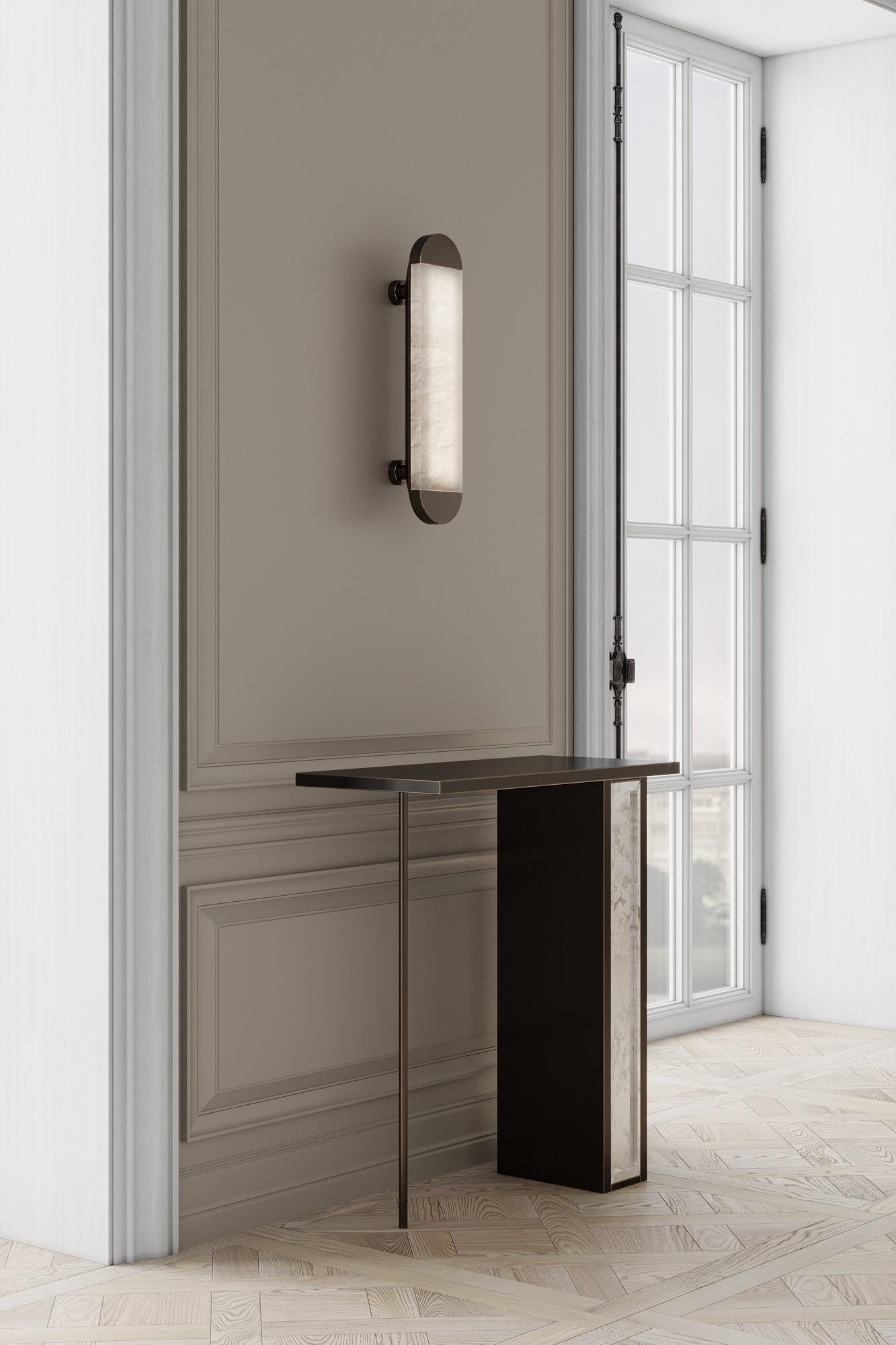 The silhouette console is designed by Emél & Browne in the Minimalist and contemporary style and custom made in Italy by skilled artisans.

The delicate vertical elements of the silhouette console table resemble slender figures on the horizon
